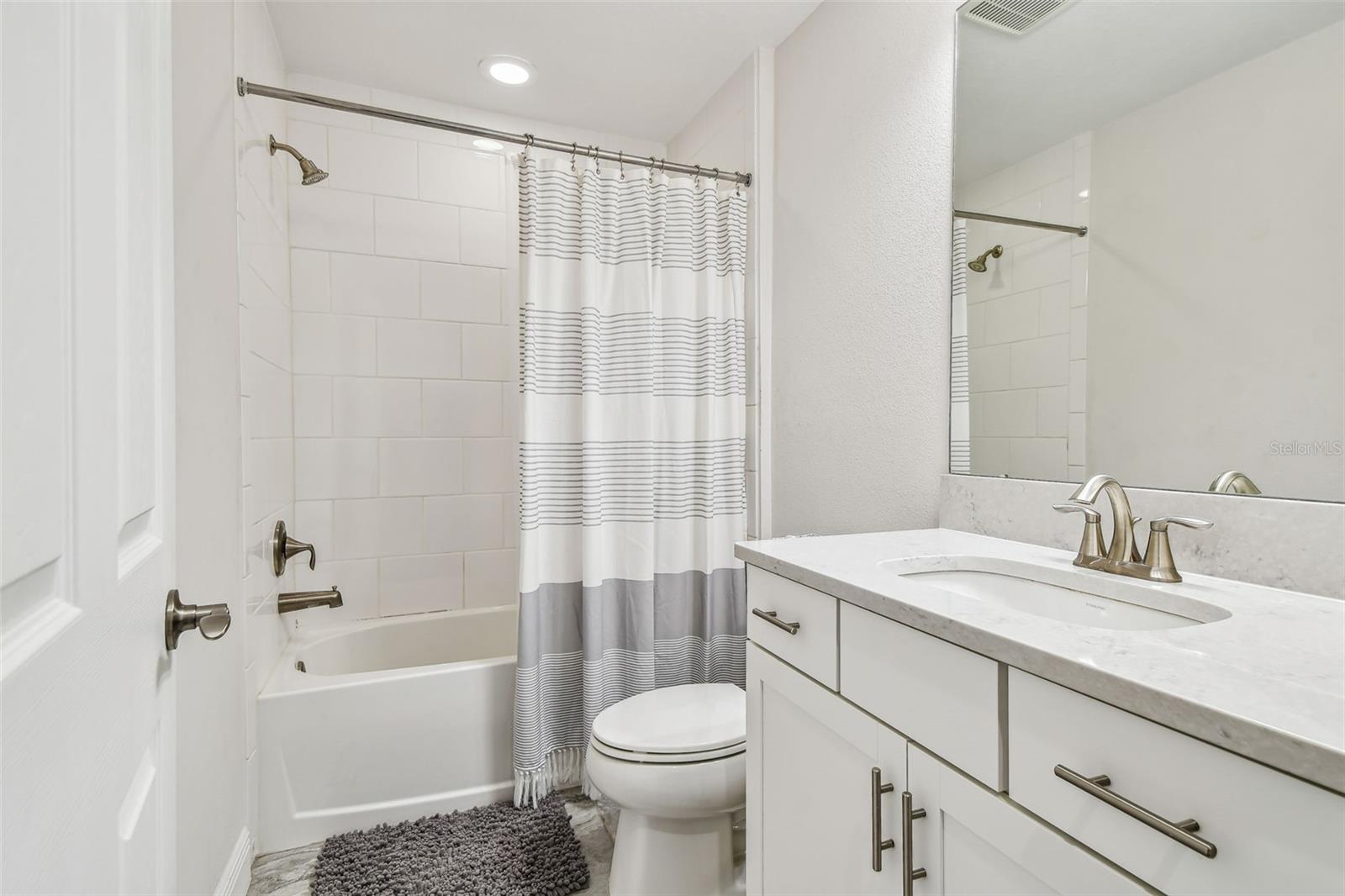 Bathroom 4 with oversized vanity & Tub/Shower Combo, in between Laundry Rm & Bedroom 5 on 2nd floor