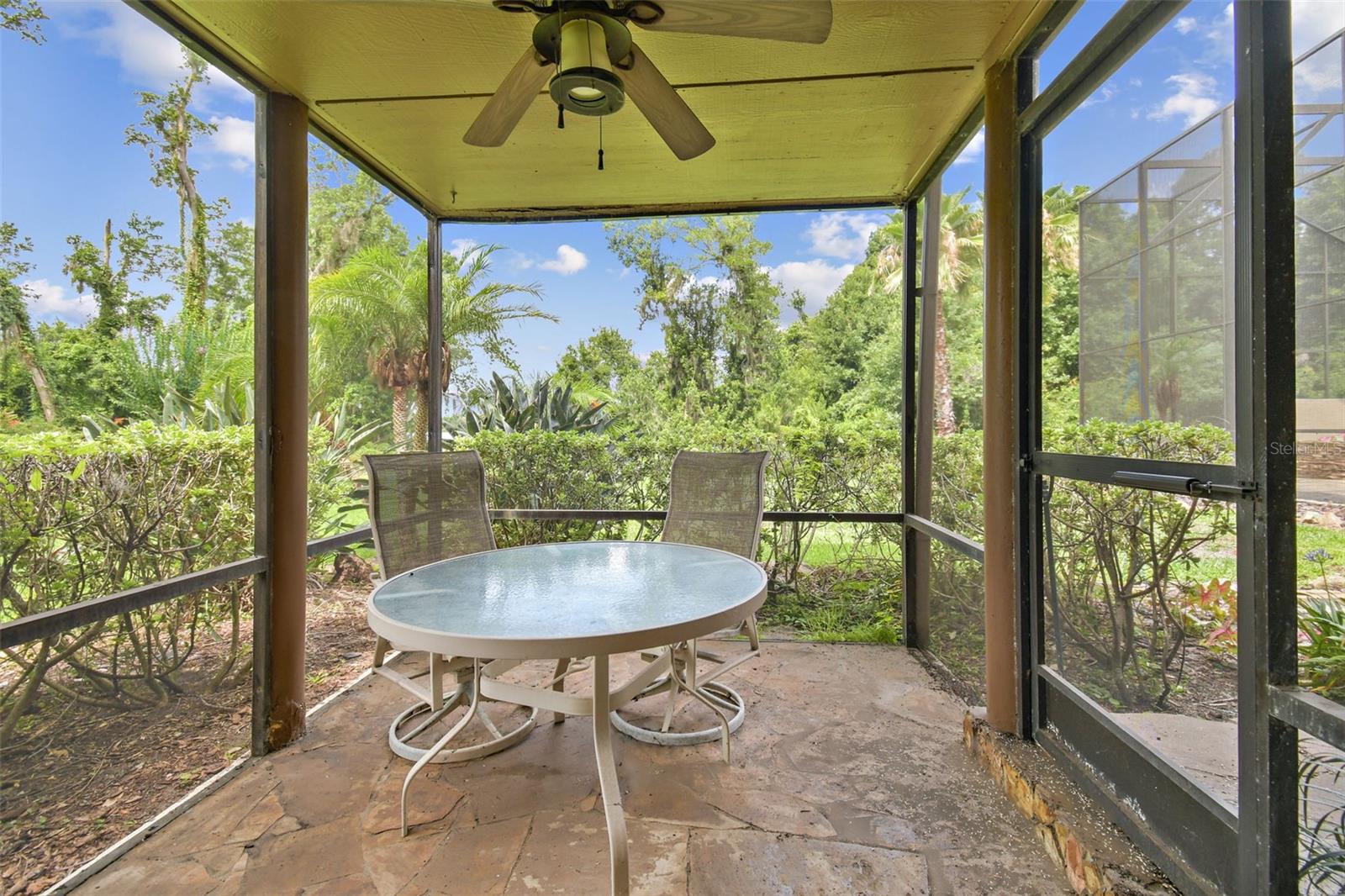 The game room has an attached screened patio.