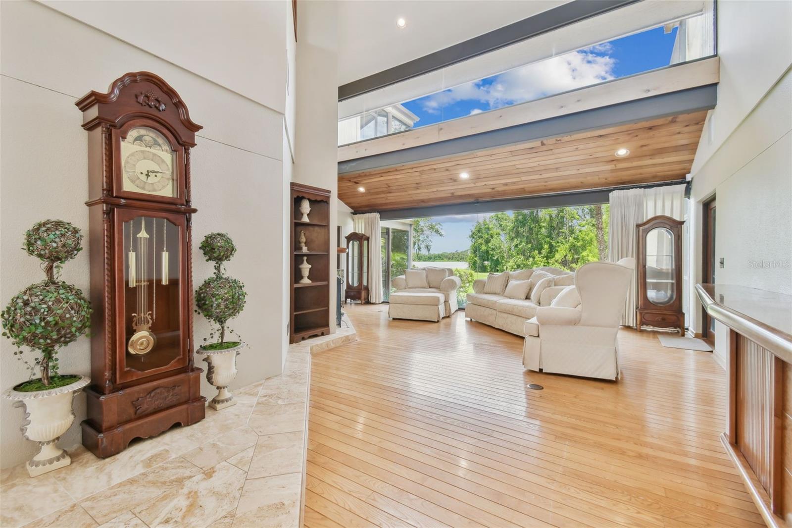 Living room with 25 foot panoramic windows with lake views
