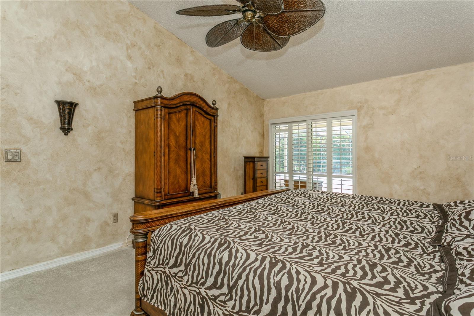 Primary Bedroom with Sliding Doors to the Pool
