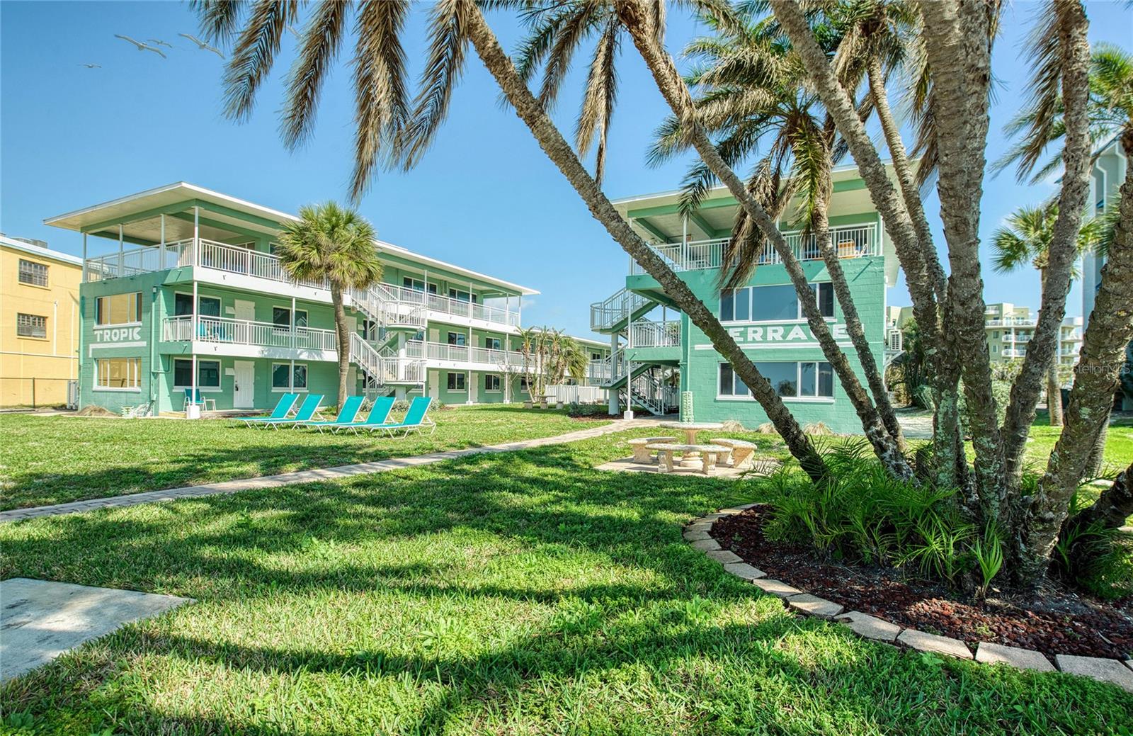 So nice, really Tropic Terrace has it all, palm trees, beautiful back lawn area, tropical feeling, right on the beach trail, the overlooking that bright white sand, to the gorgeous waters of the Gulf!  It truly has everything you could want for this price point!