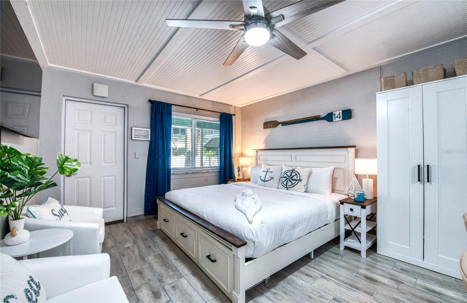 Beautiful continuous flooring and a nice pocket door to the bathroom