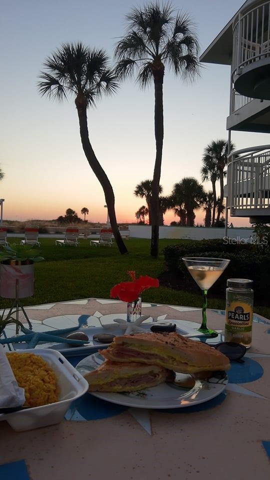 Dine Al Fresco outside like we did on the beautiful patio cement custom made table and chairs.  We chose a cuban sandwich from The Floridian and a dry martini with olives.