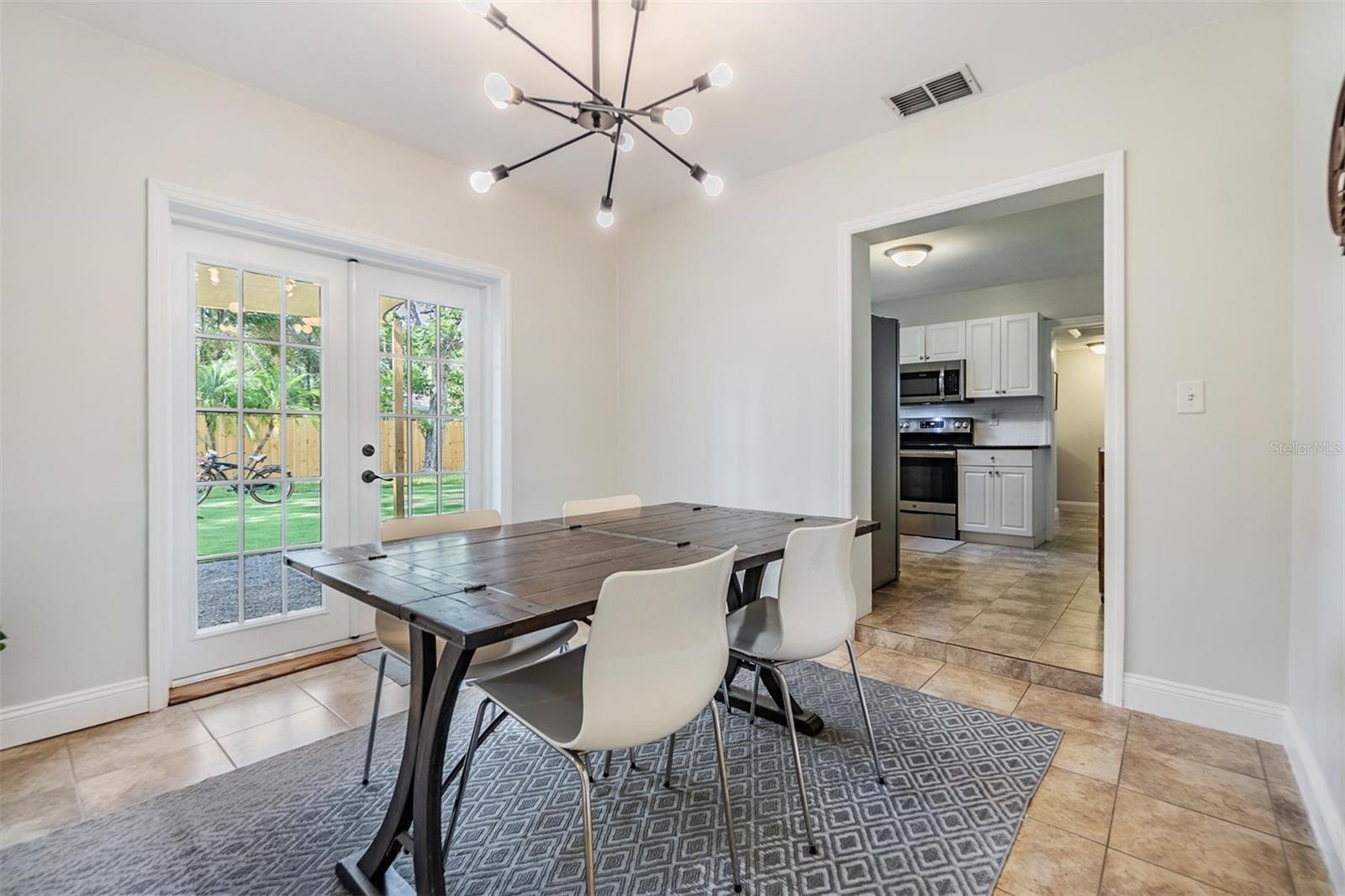Dining room with French Doors leading to beautiful back yard oasis