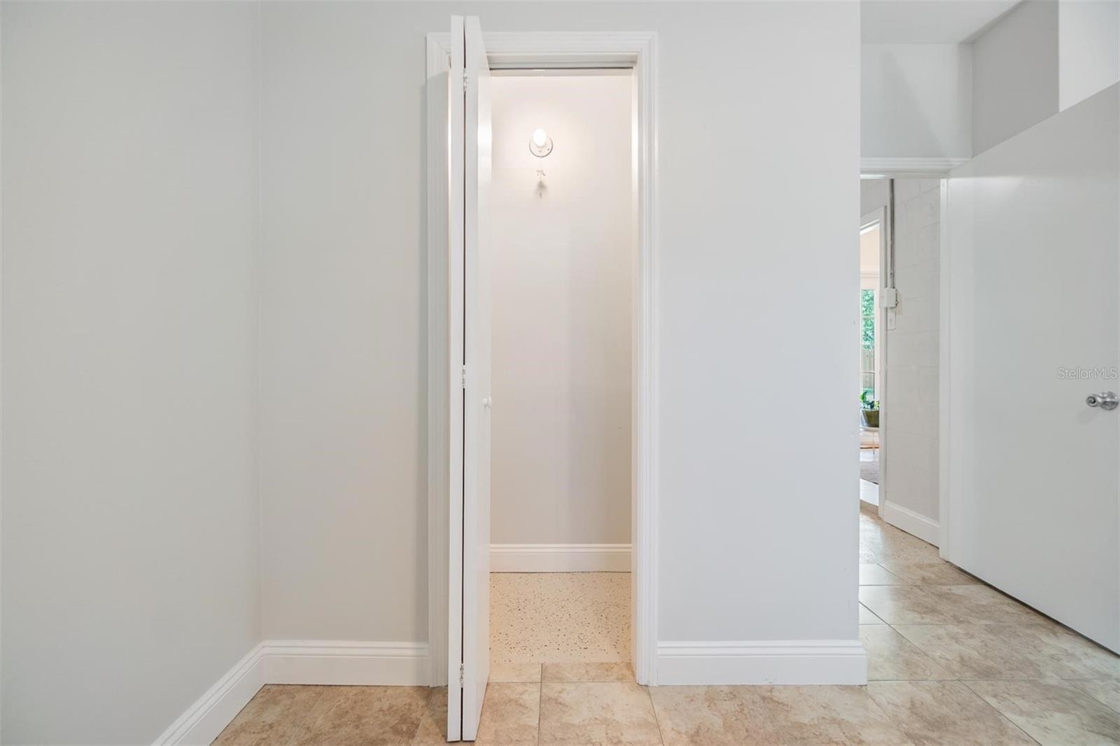 Primary bedroom walk in closet