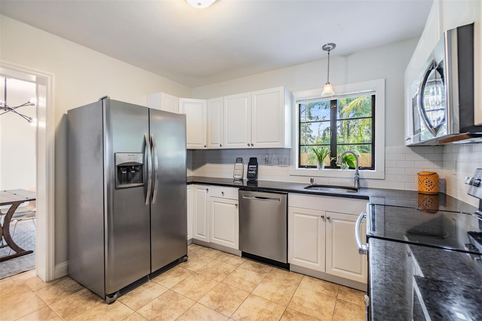 Newer stainless steel appliances and solid counters