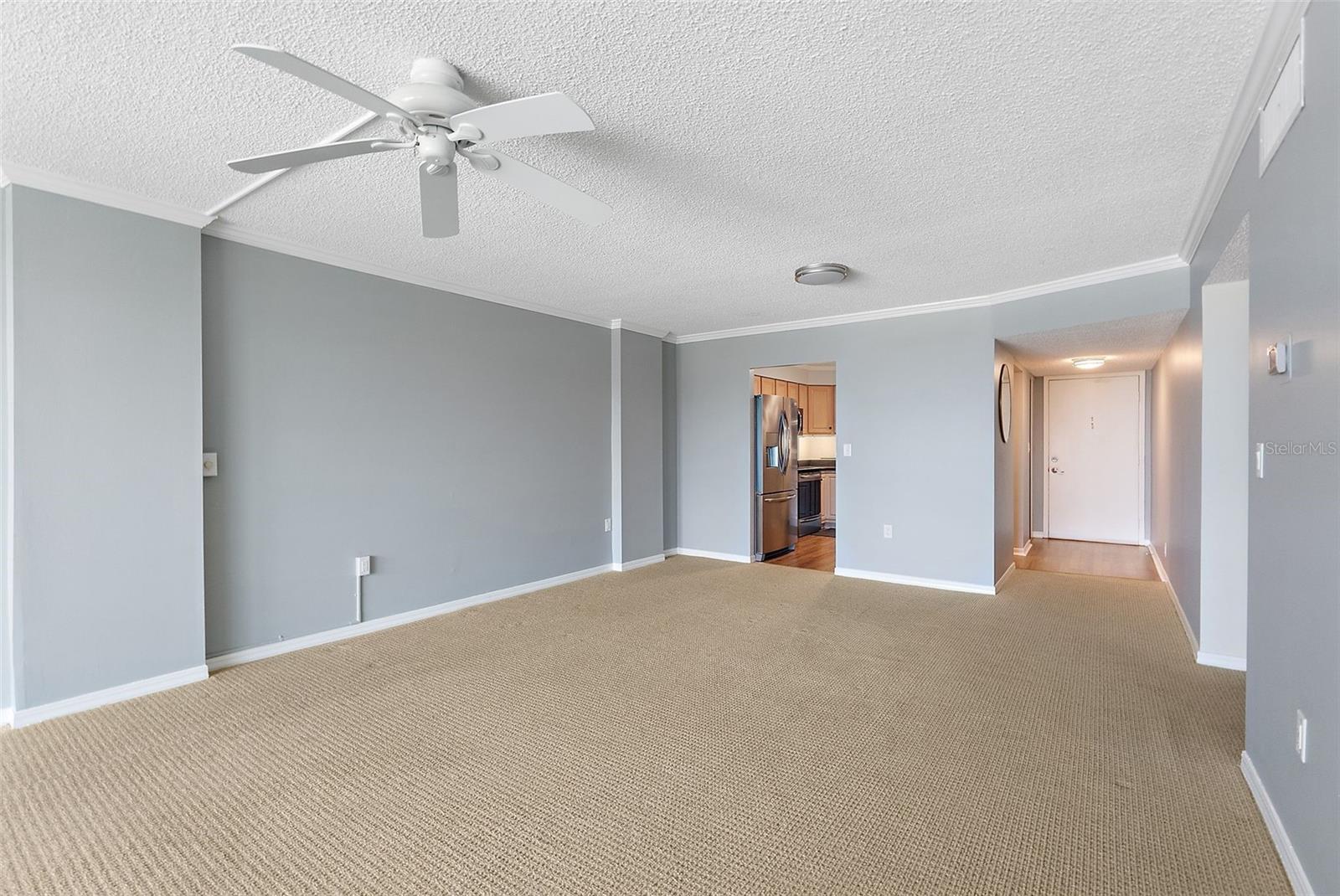 SPACIOUS LIVING AND DINING ROOM WITH AMPLE CHOICES FOR FURNITURE PLACEMENT