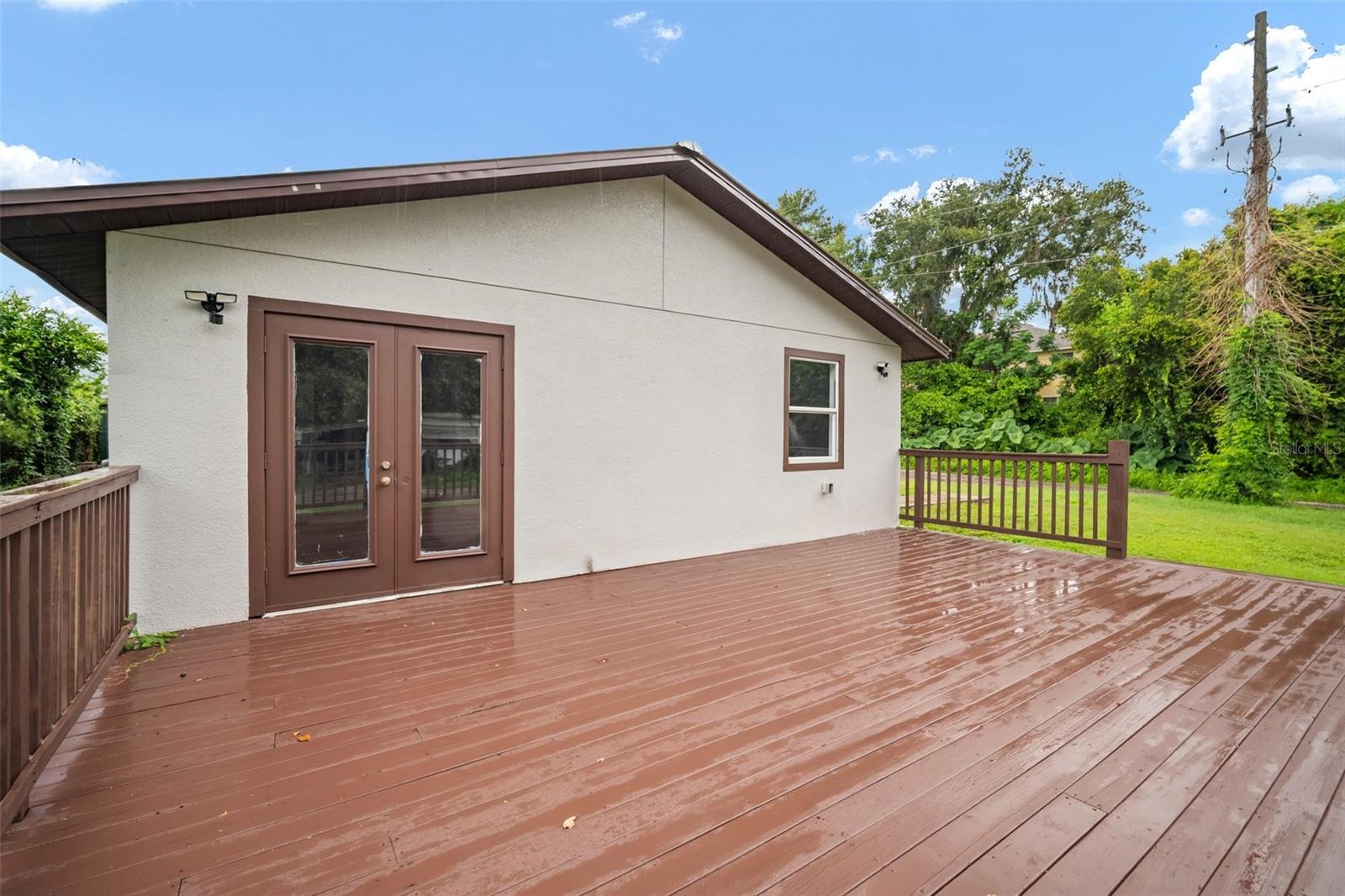 Deck with French doors to Primary bedroom