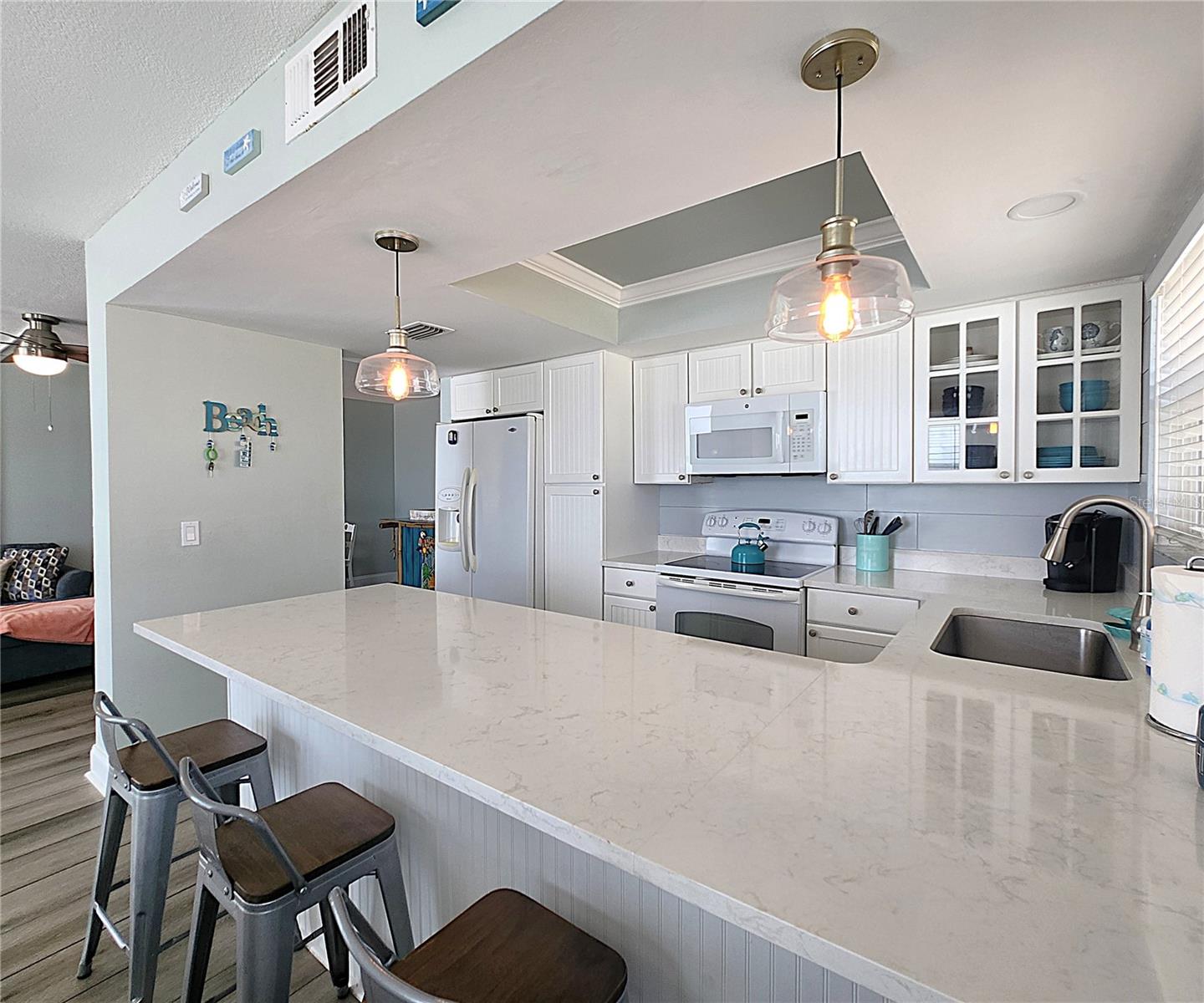 Turnkey: Quartz countertops.  All furniture, appliances, bedroom furniture & bedding, towels, etc. conveys with the sale