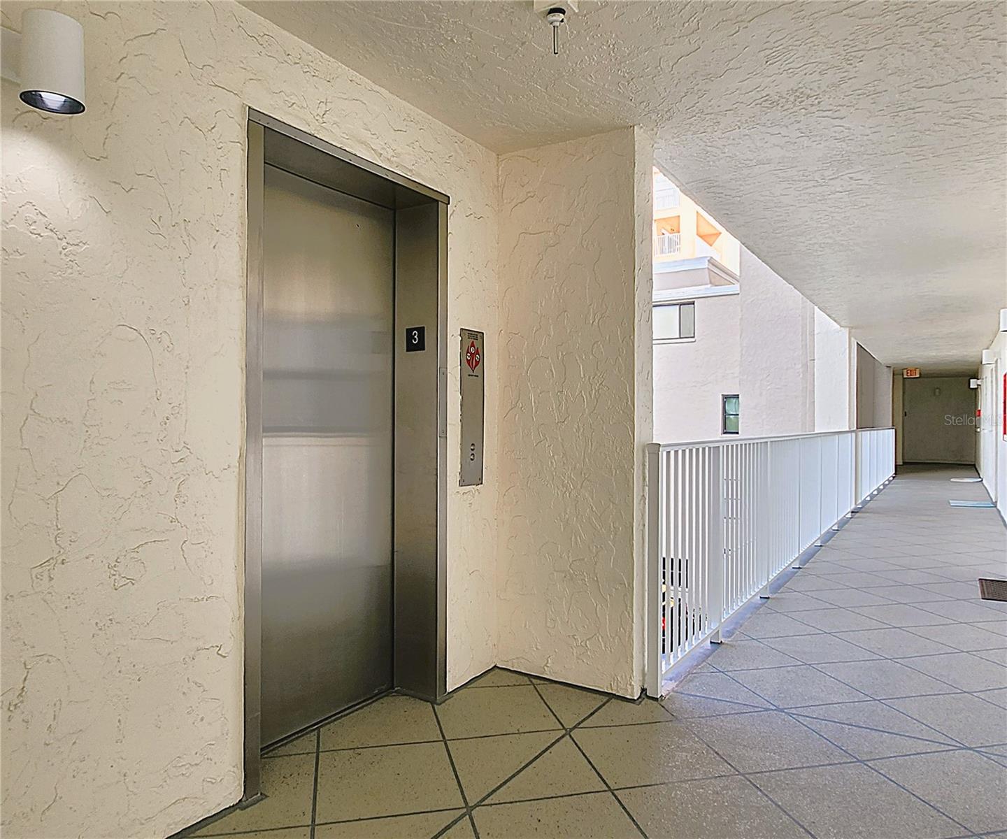 Elevators steps from the end unit condo