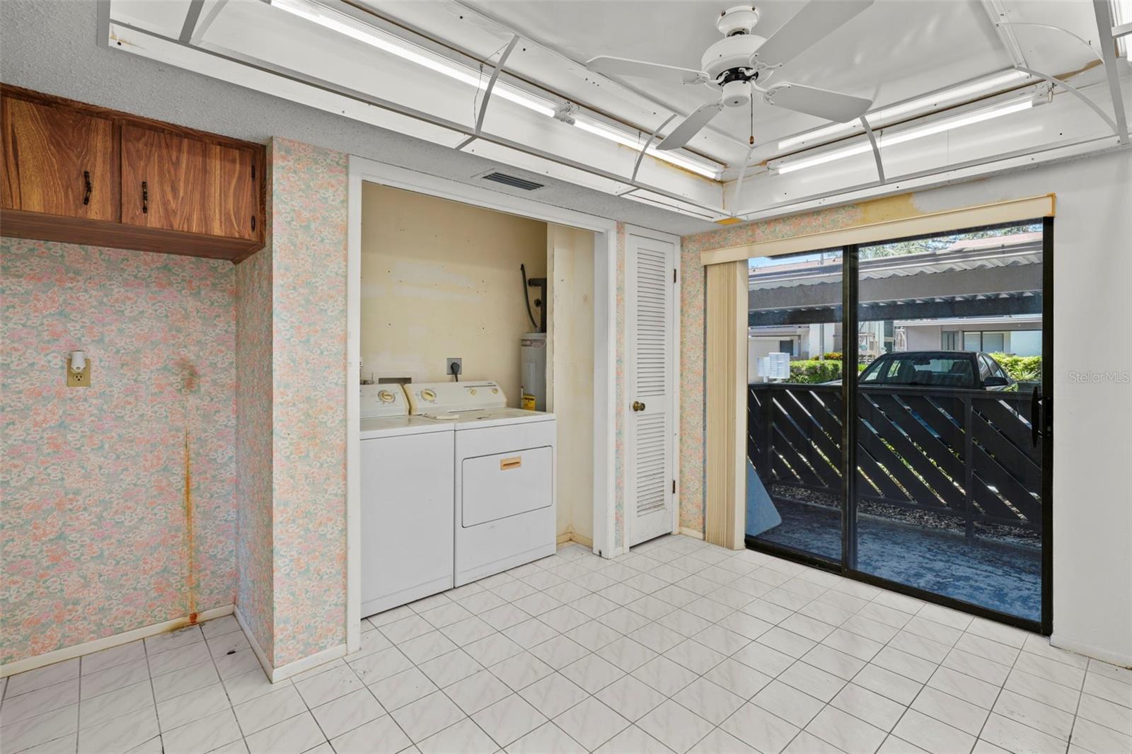 View of pantry, laundry closet, front outdoor covered lanai (in addition to the large lanai overlooking the backyard).