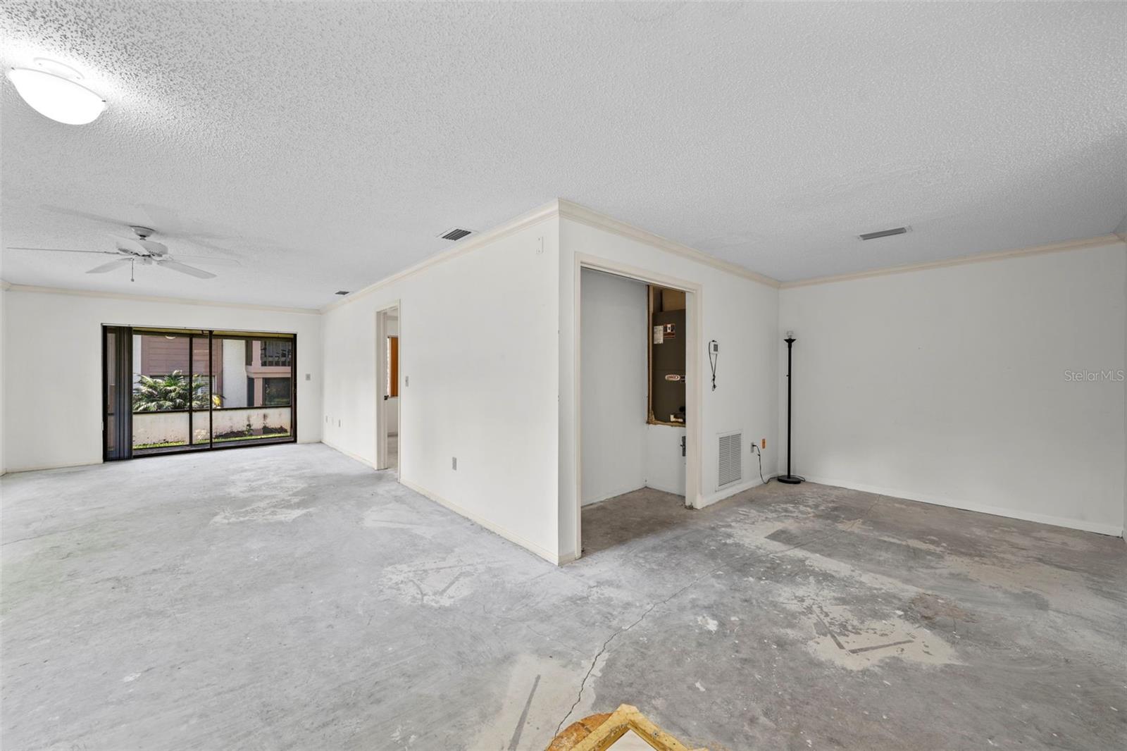 From front door - Family room (left), Dining room (right).  Choose your own flooring -- make this your OWN!