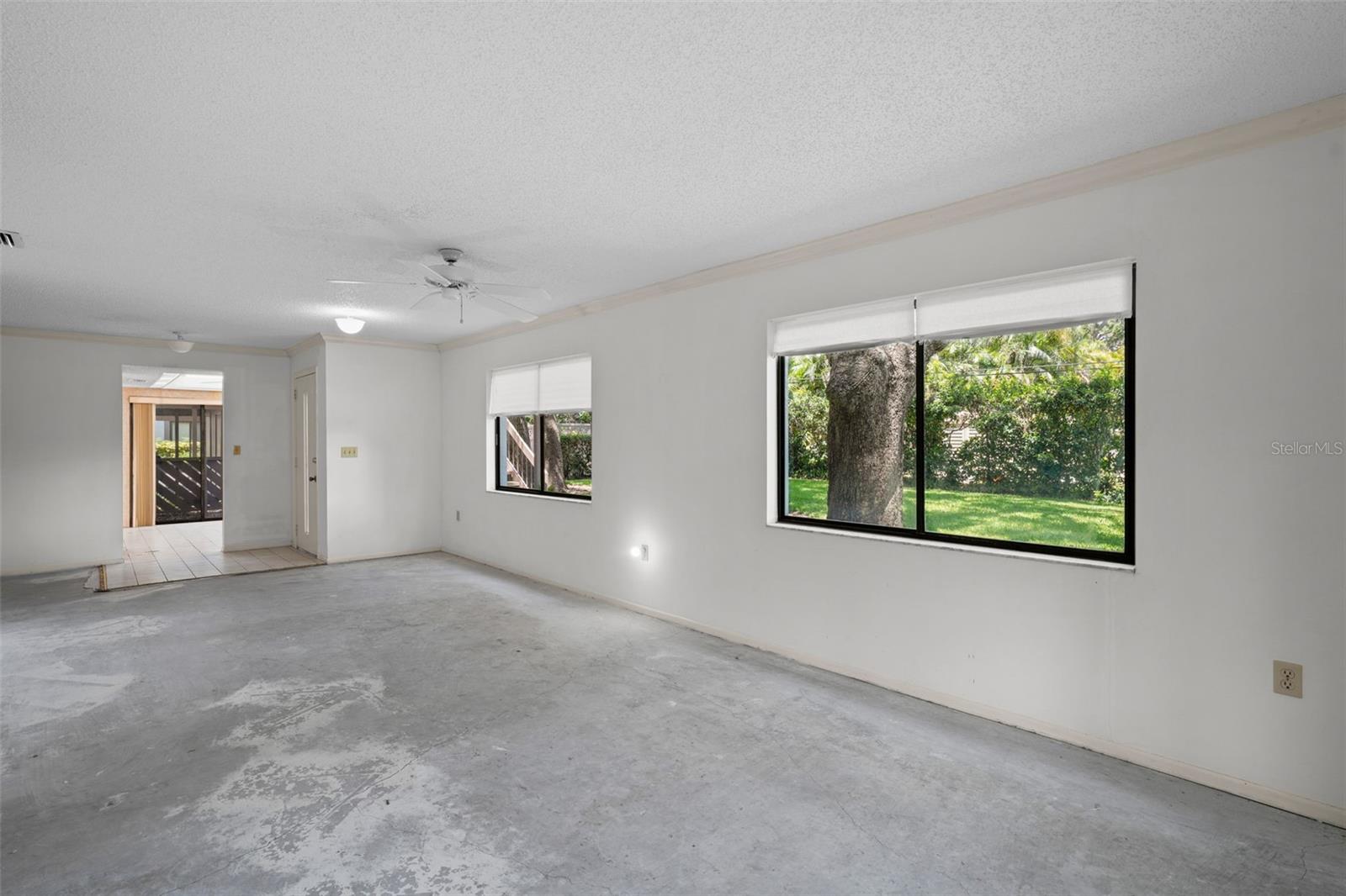 View from lanai to front door with kitchen in rear.