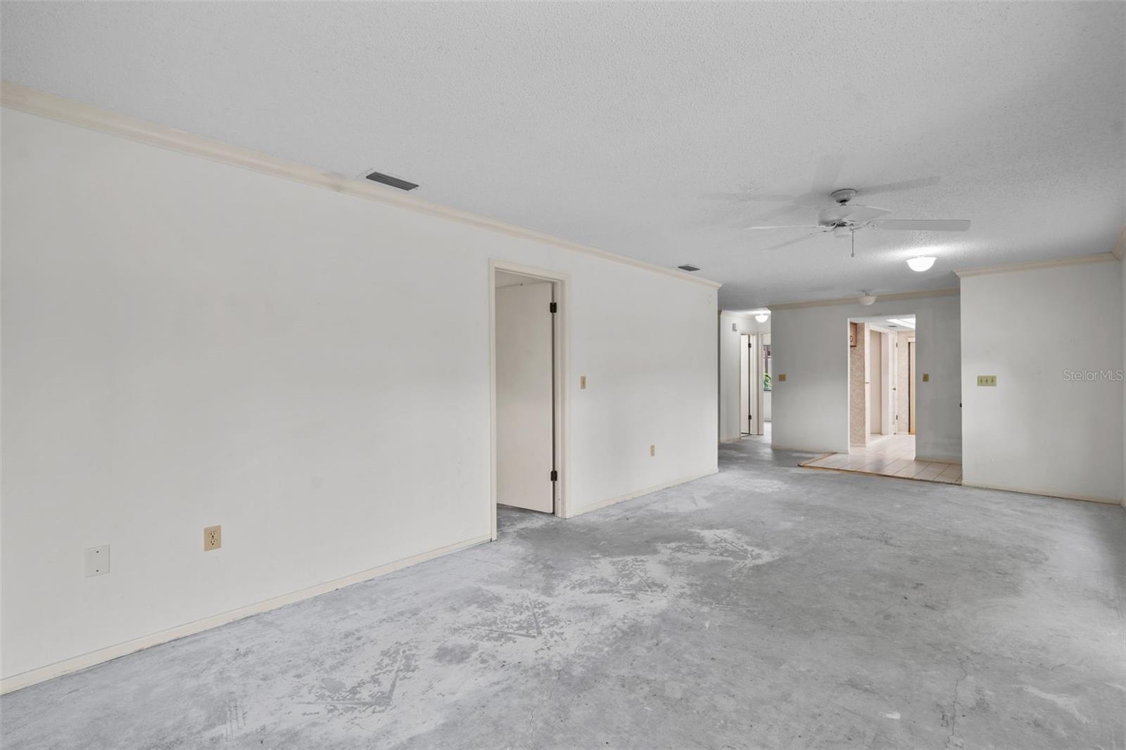 From lanai -- View of family room with mater BR on left and kitchen and 2nd bath beyond.