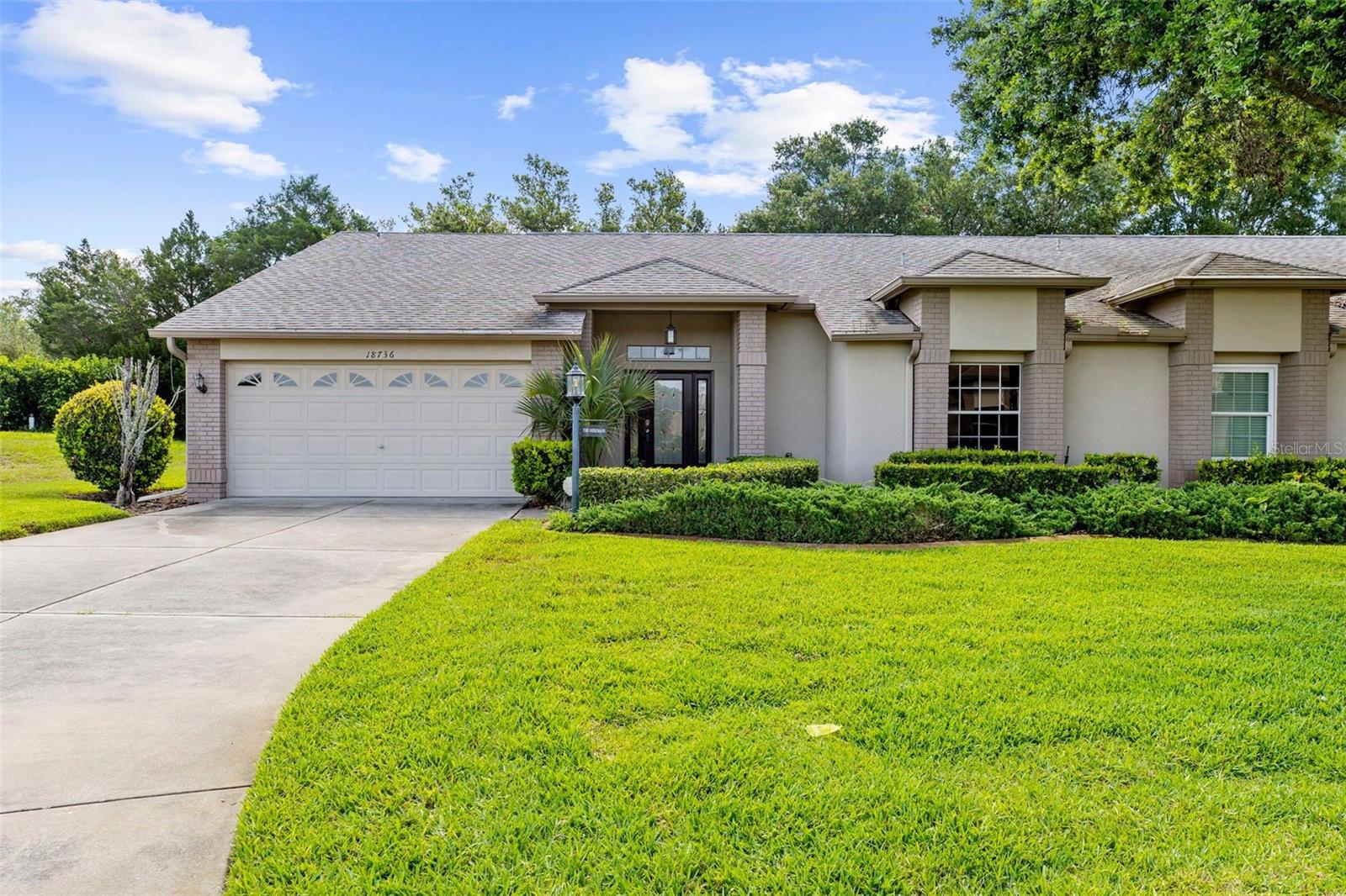 Front with long driveway