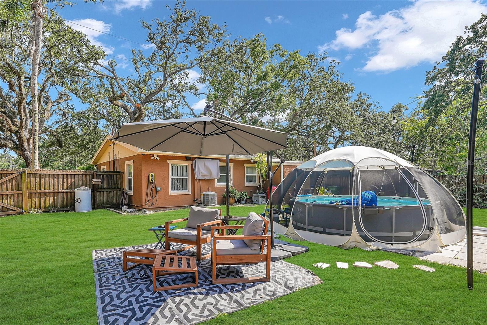 Make beautiful memories in this oversized yard with pool and various retreat areas!