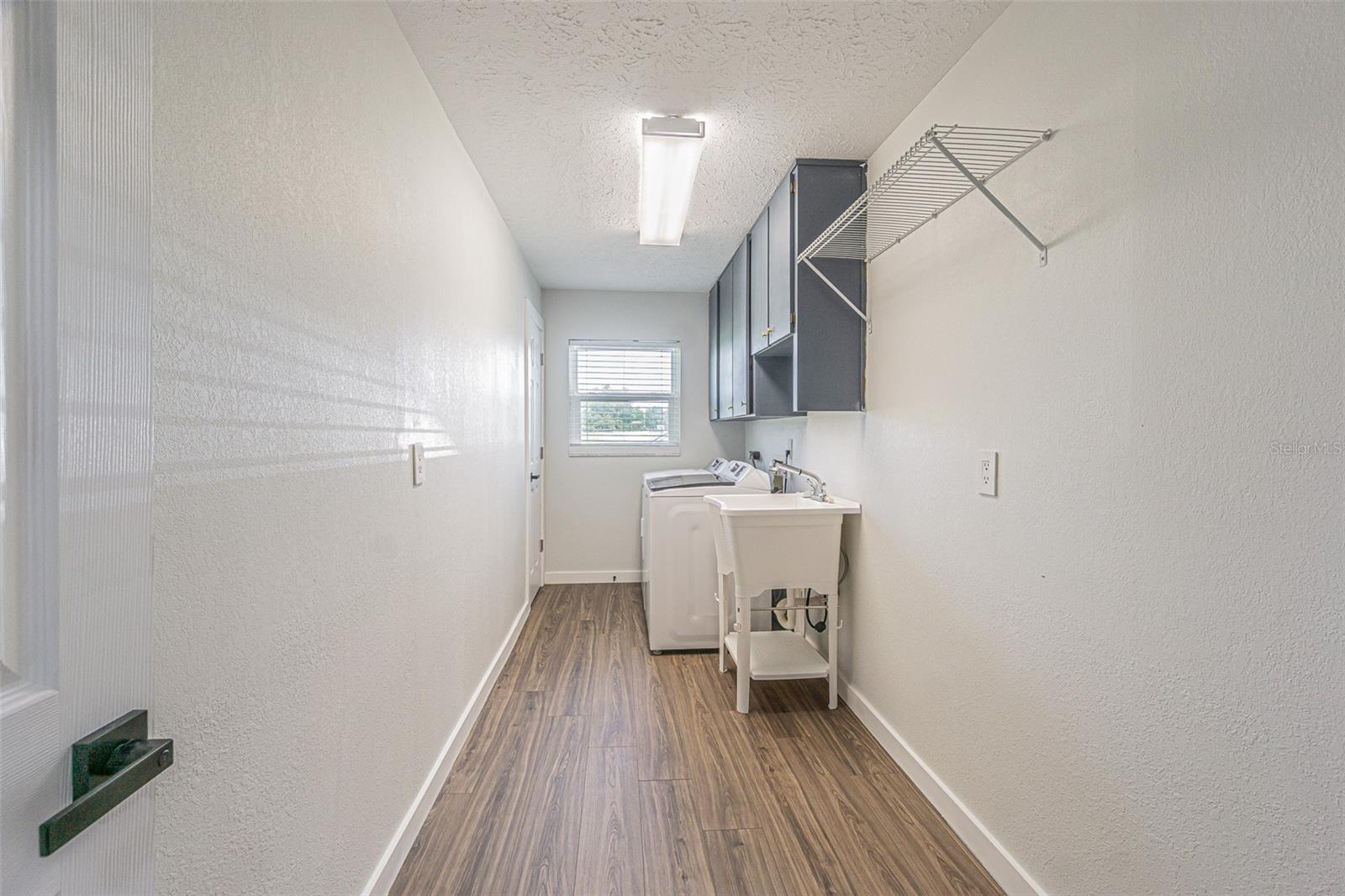 Oversizied Laundry-with storage closet-immediately to the right upon entering through teh garage.