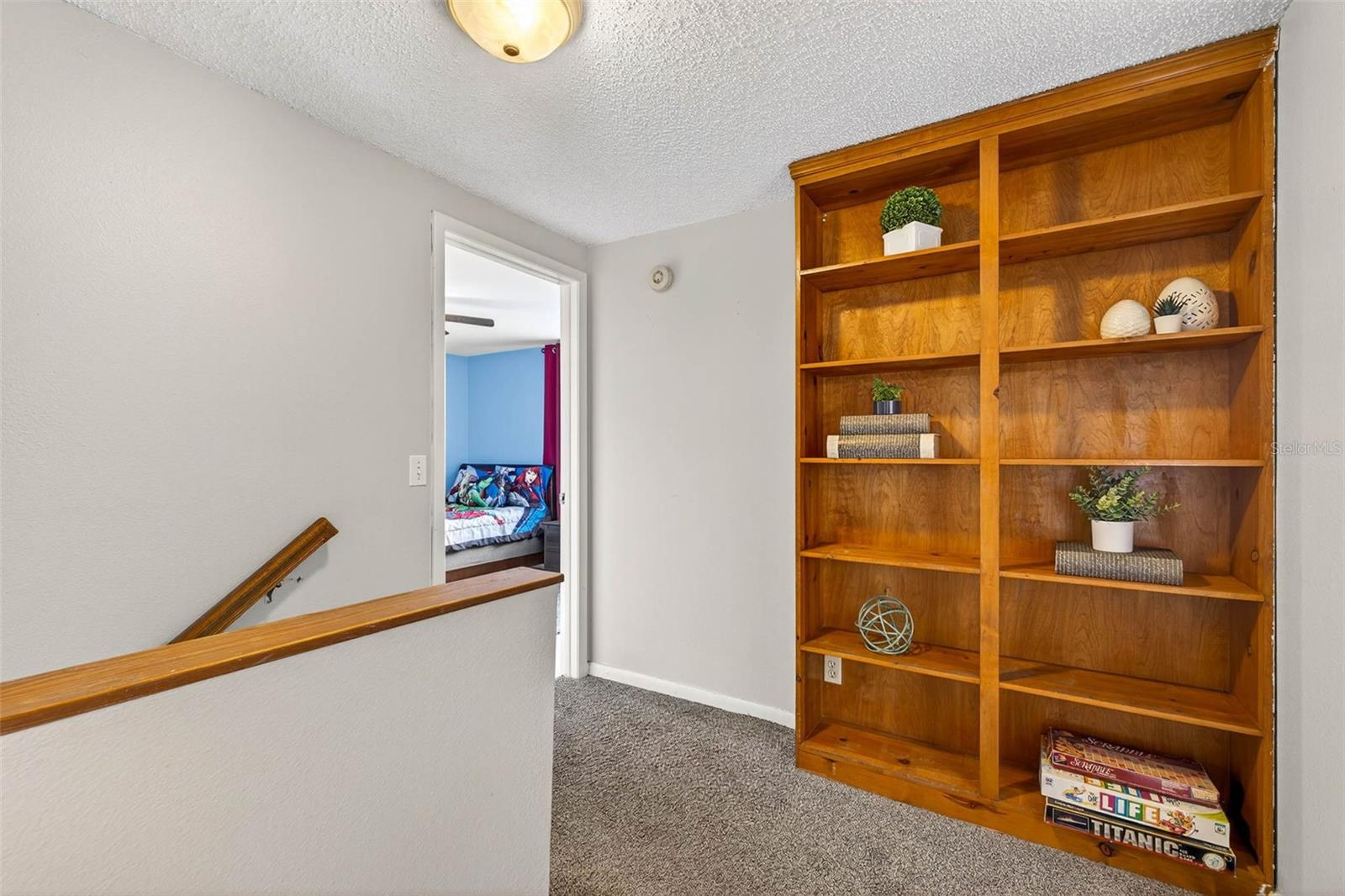 Built In Bookshelf at the top of the stairs for all of your families' memories