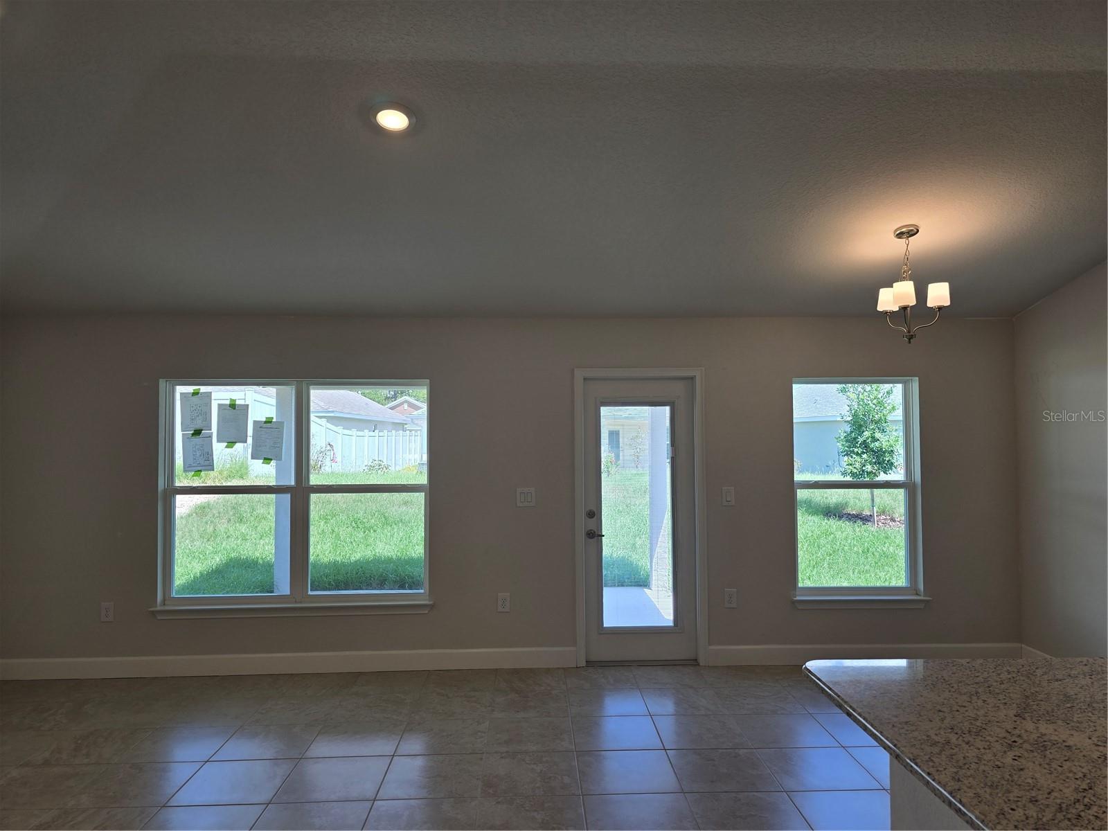 Big Living room overlooking covered patio to back yard