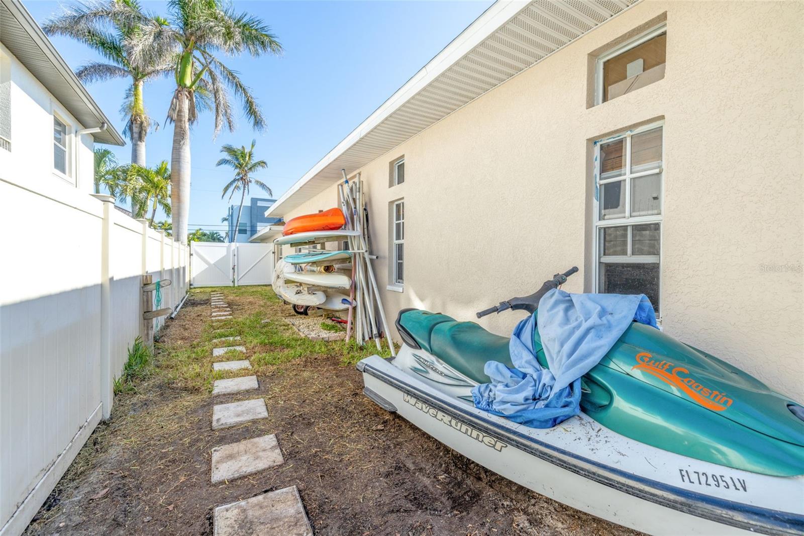 Side of house offers storage for water toys