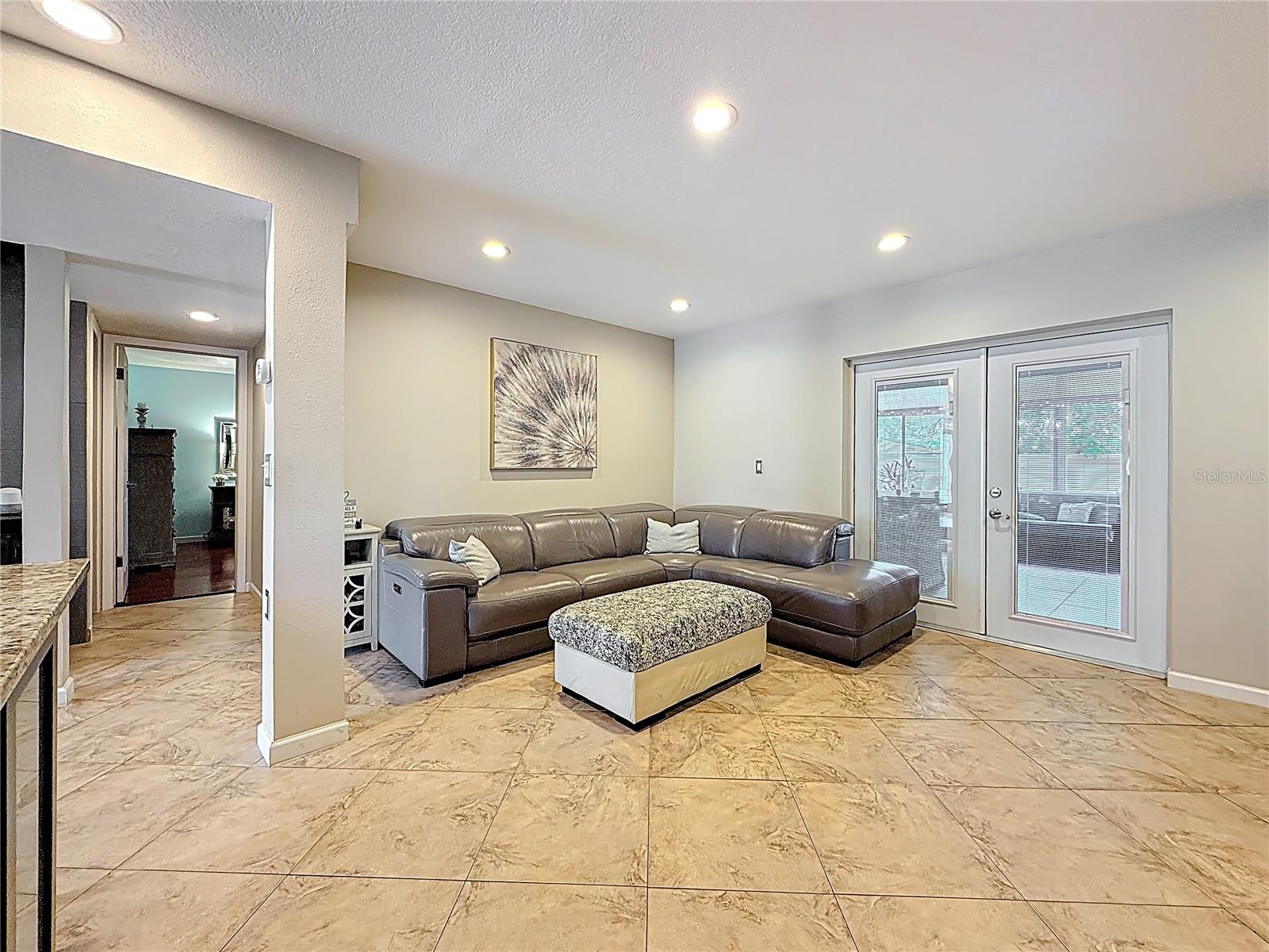 TV nook in kitchen area with built in electric fireplace, TV and surround sound system