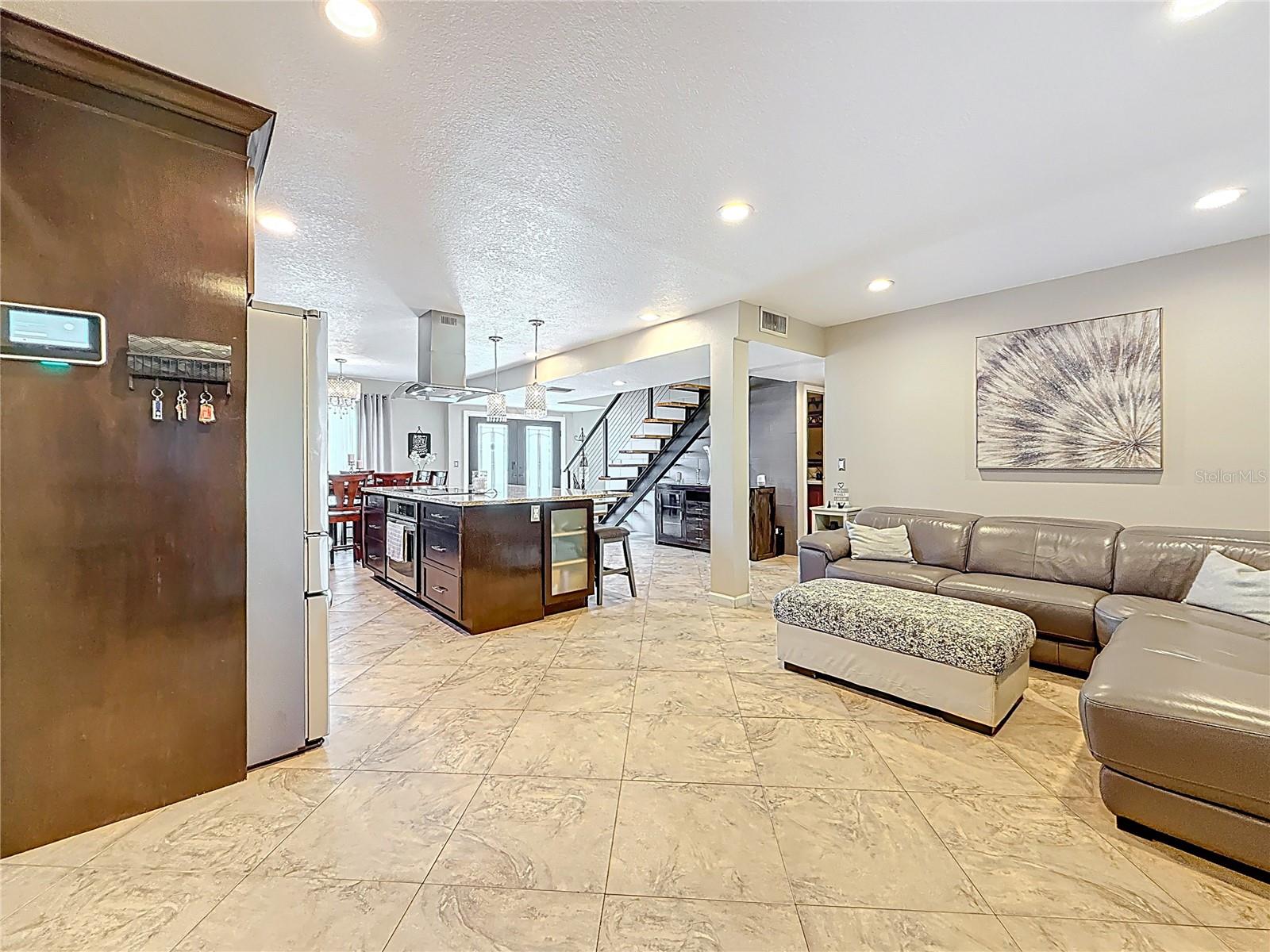 TV nook in kitchen area with built in electric fireplace, TV and surround sound system
