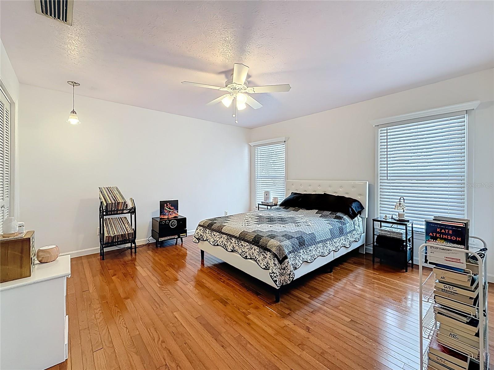 2nd bedroom with wooden floor and lots of closet space