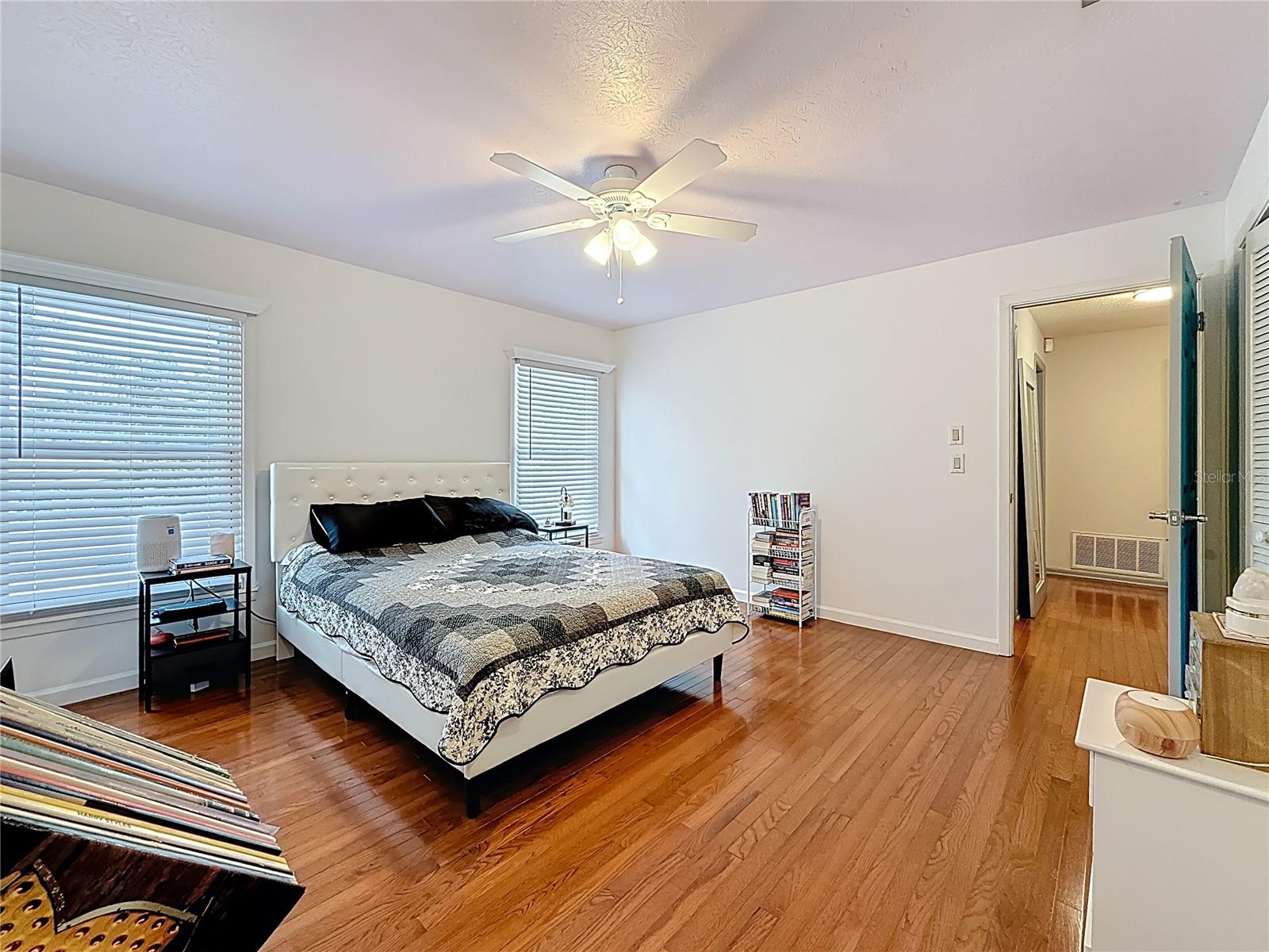 2nd bedroom with wooden floor and lots of closet space