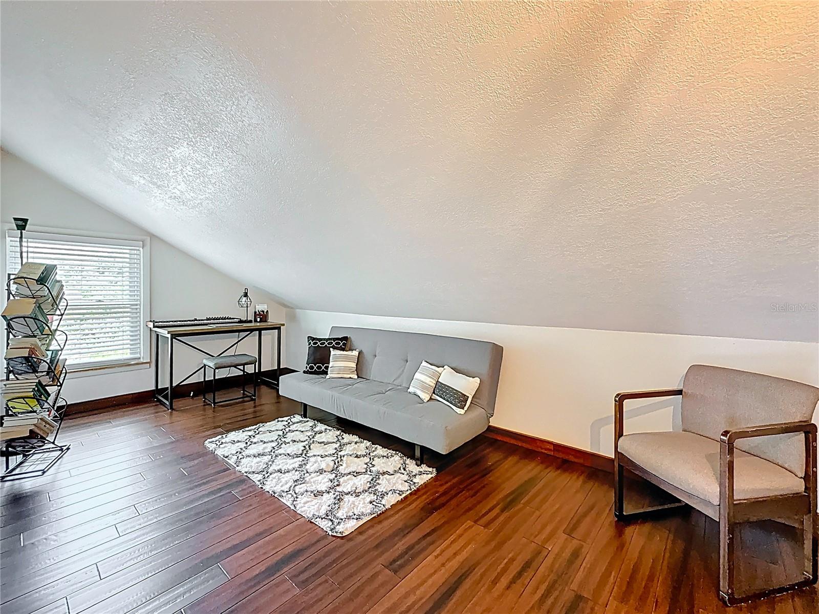 1st flex room with wooden floor