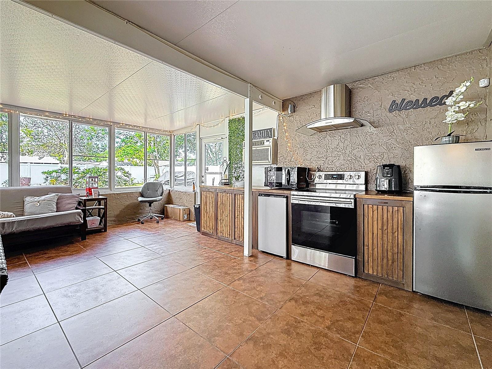 800 SF entertainment room with appliances