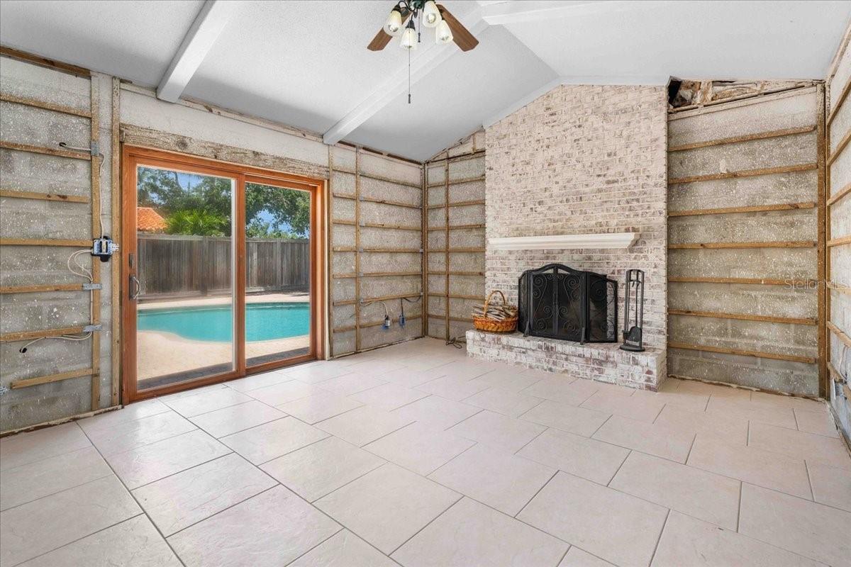 Great room with sliding glass door out to the pool area