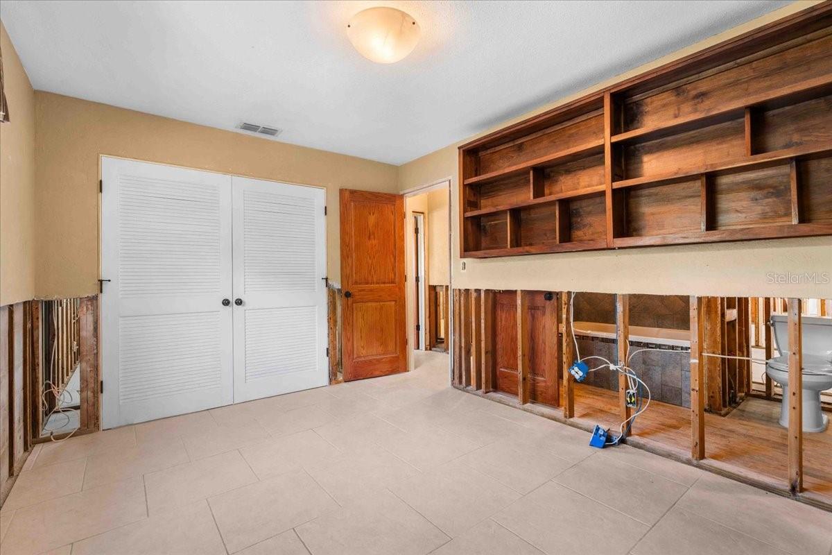 Bedroom 2 with closet and hand made built in shelves