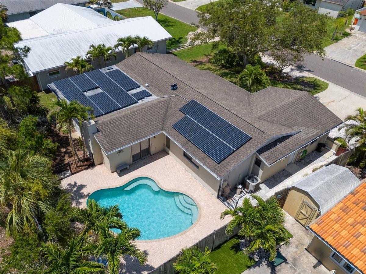 Aerial view, showcasing solar panels and pool