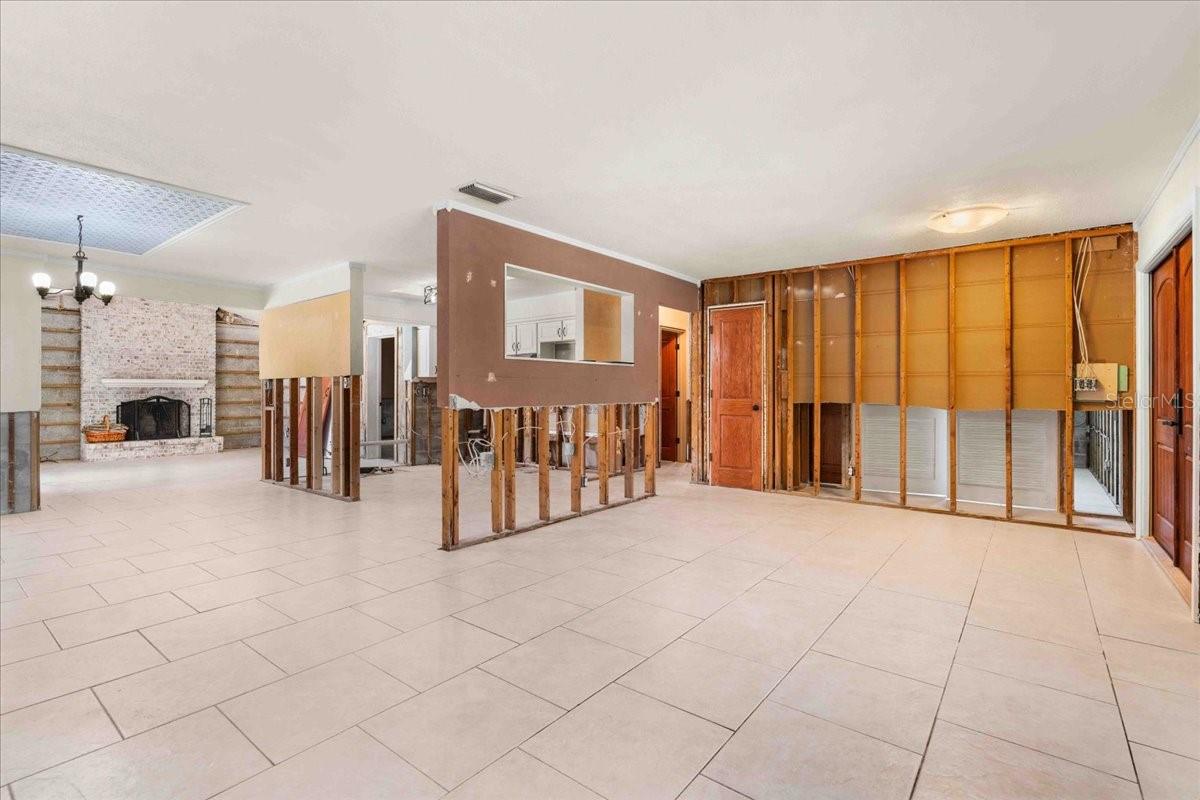 Full view of the living area, kitchen and great room with fireplace