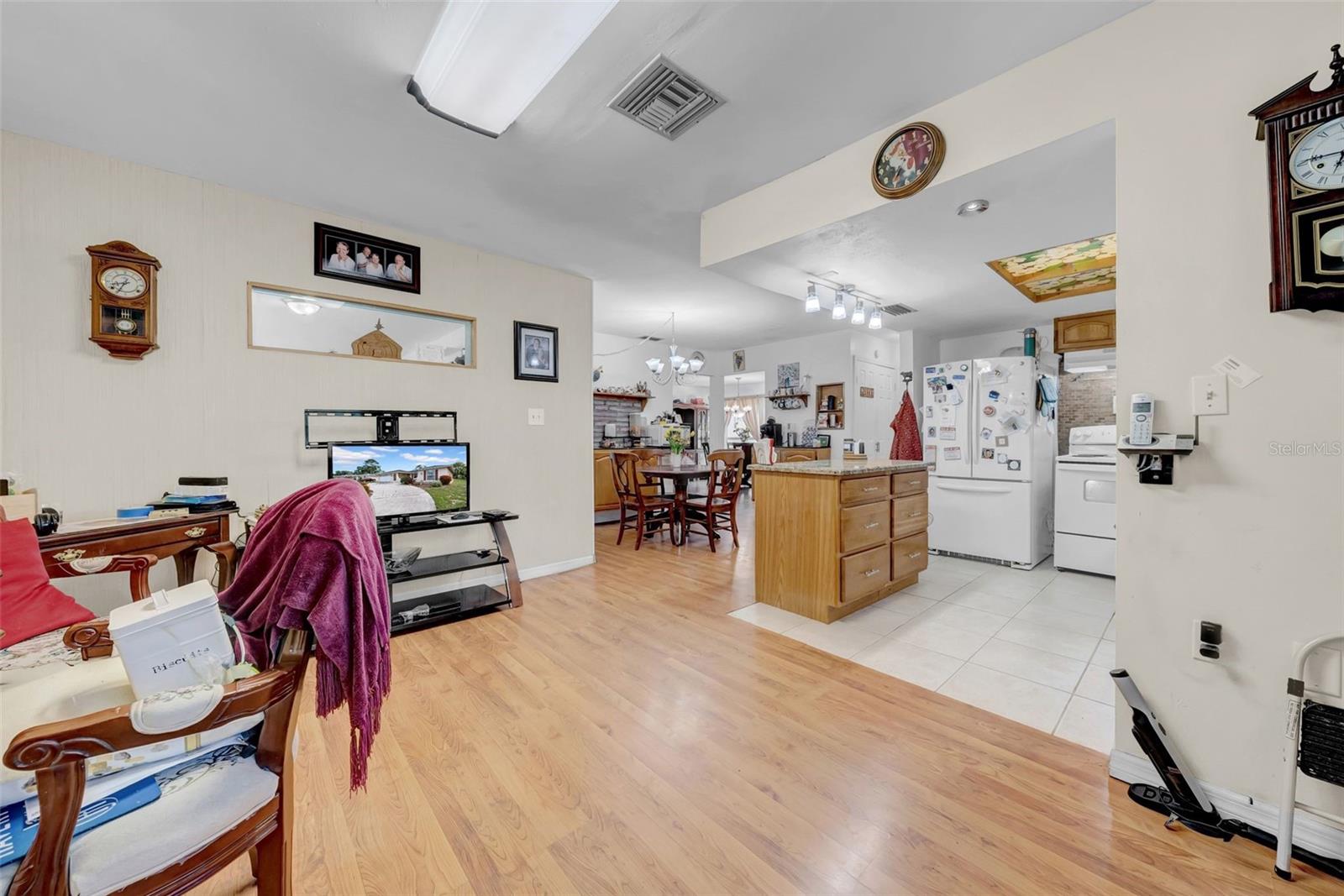 Talk about an open concept kitchen with space for another living room!