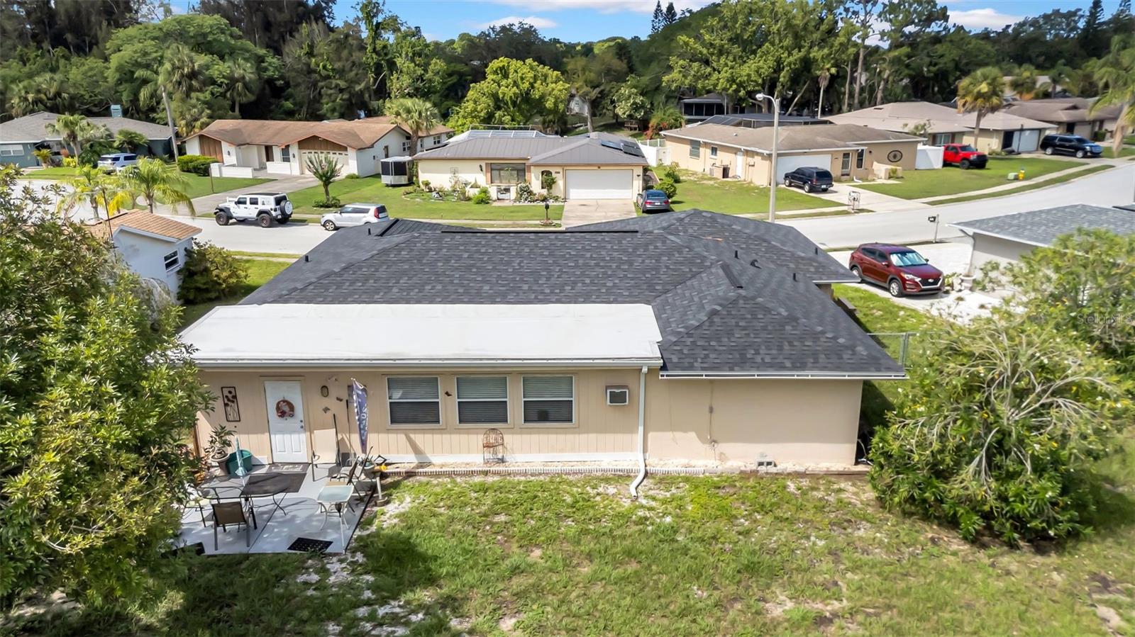Outdoor patio and fenced in spacious yard