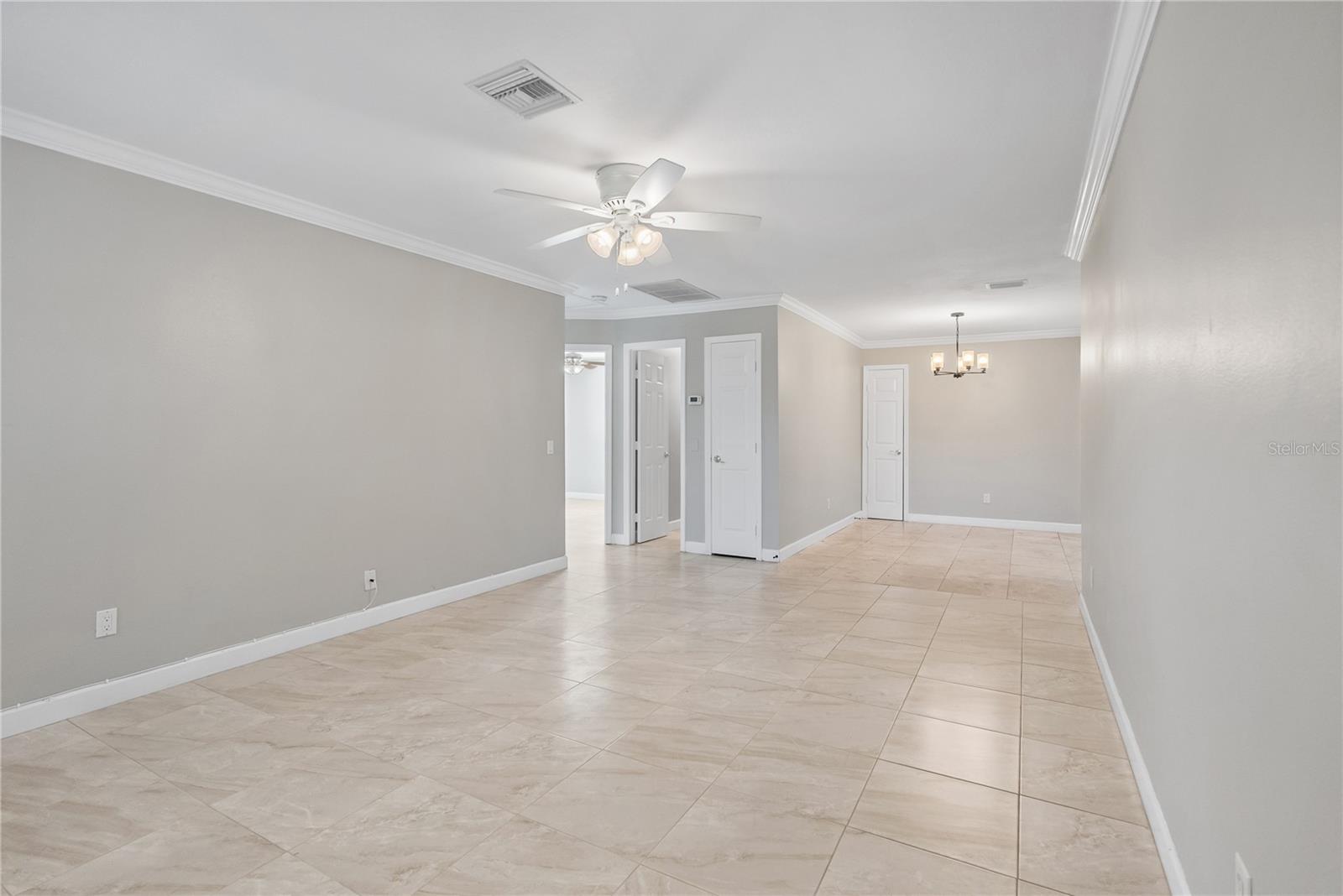 living room with dining area in background