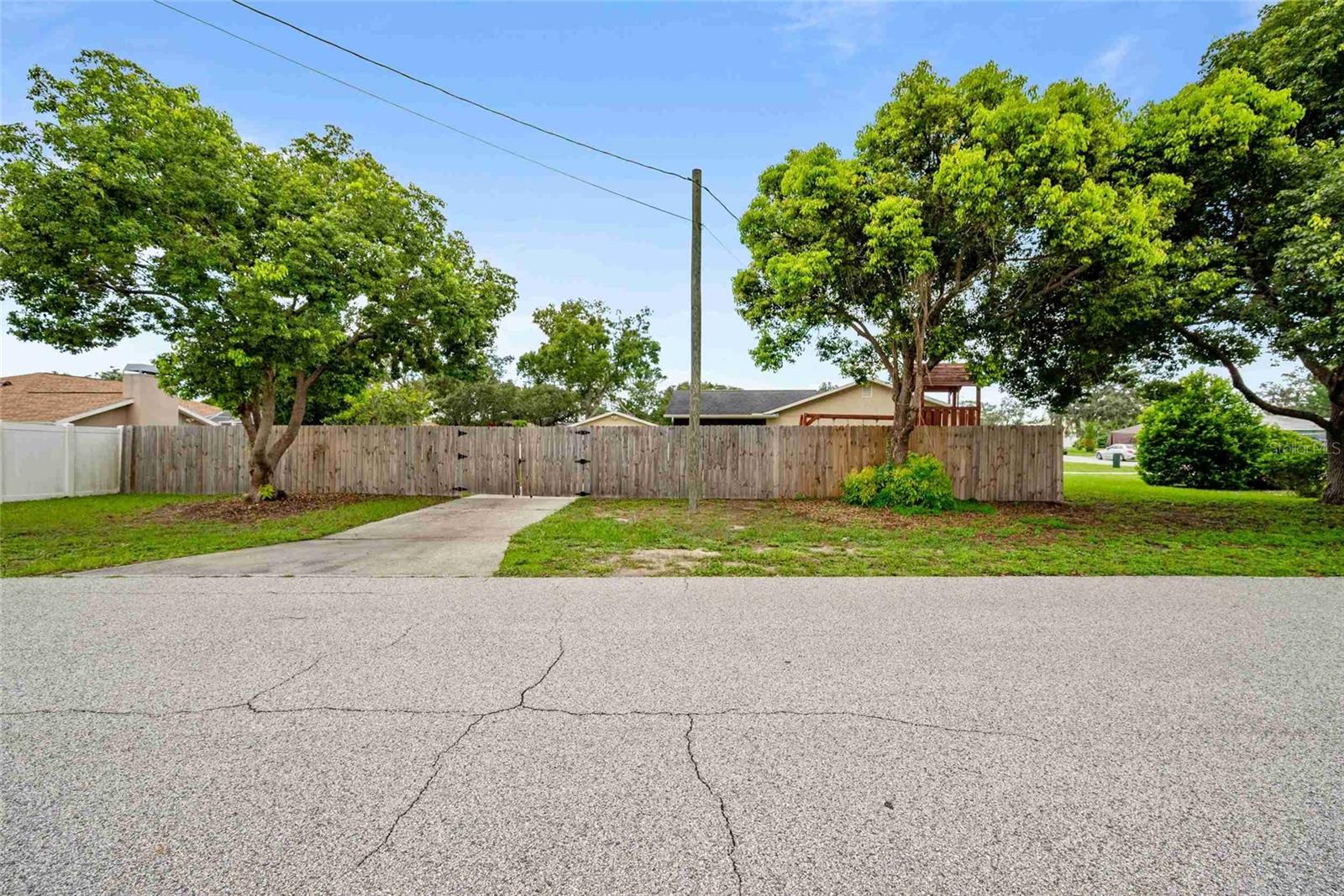Side driveway leads to 2nd garage