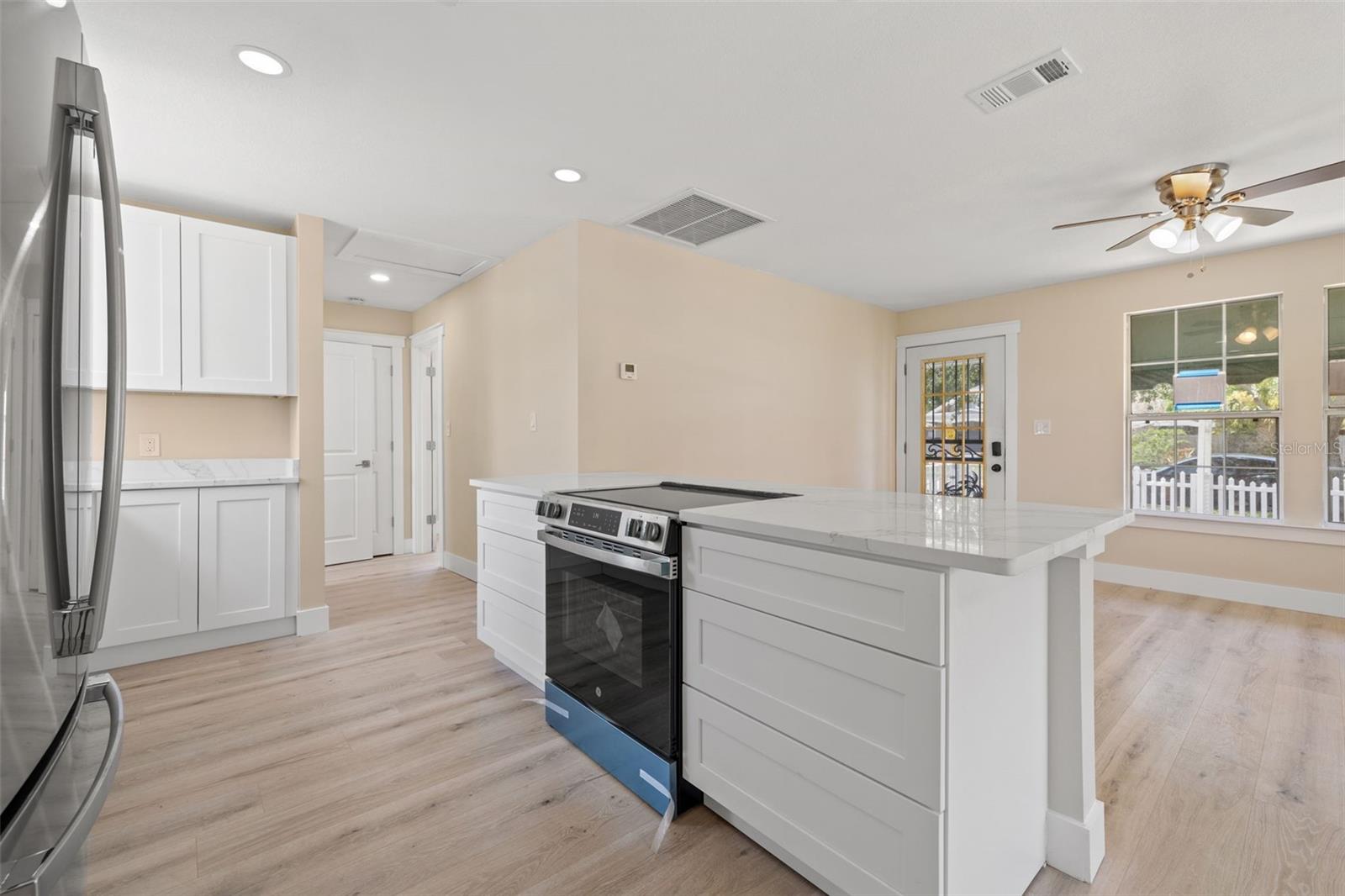 Beautifully updated kitchen , quartz countertops, open concept