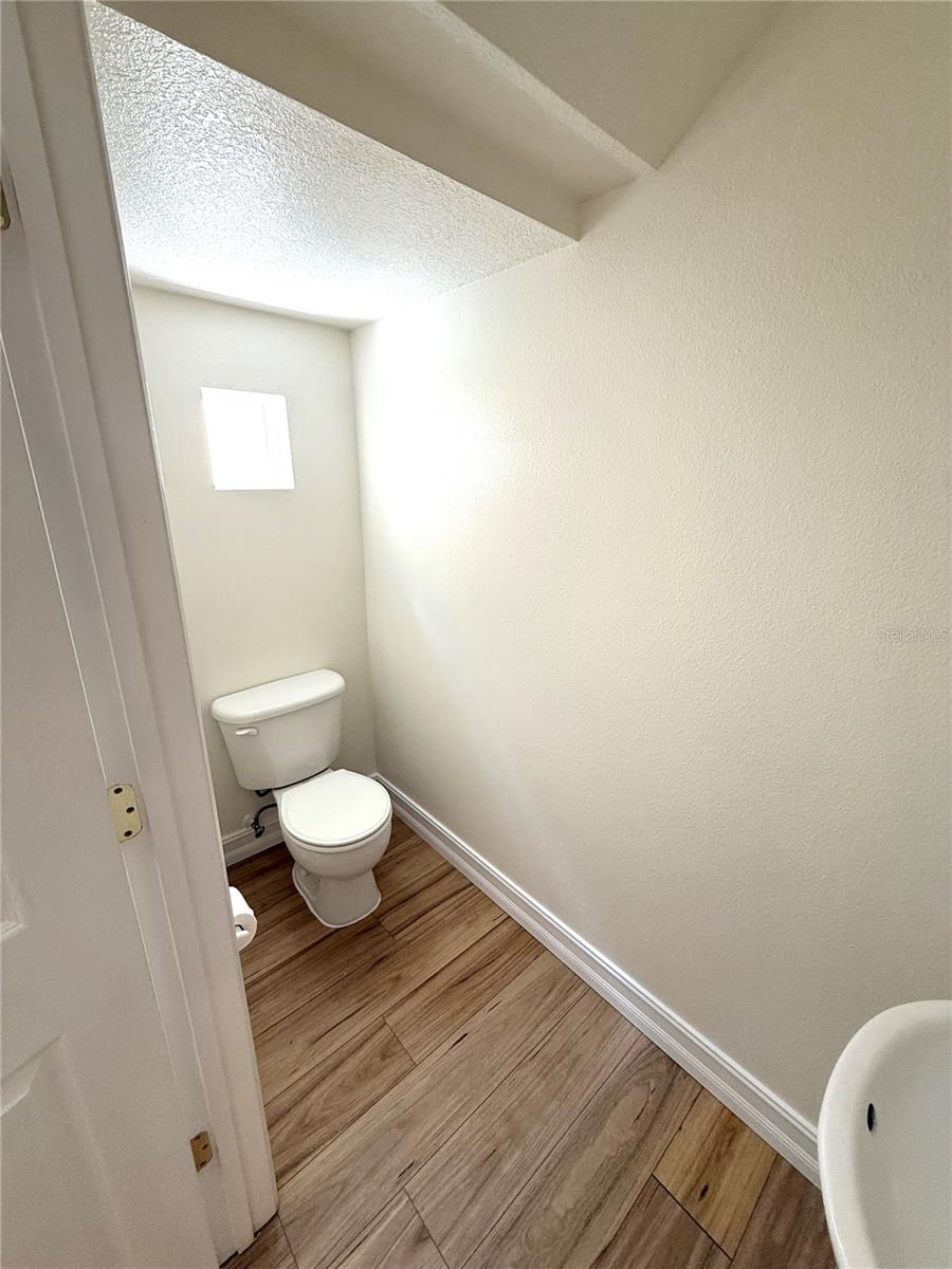 Conveniently located on the main floor, this stylish half bathroom is perfect for guests and everyday ease—combining function and charm right where you need it most!