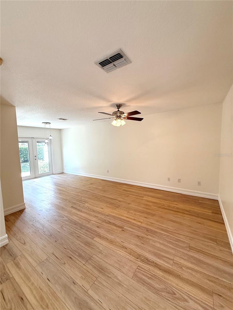 Bask in the glow of a spacious living room filled with natural light pouring through large windows. This bright, airy space is perfect for relaxing, entertaining, or simply soaking in the sunshine from the comfort of home.