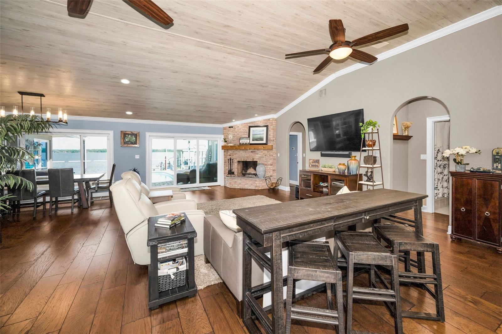 Fully updated interior.  This is a massive great room! Wood floors, fireplace, impact windows and more