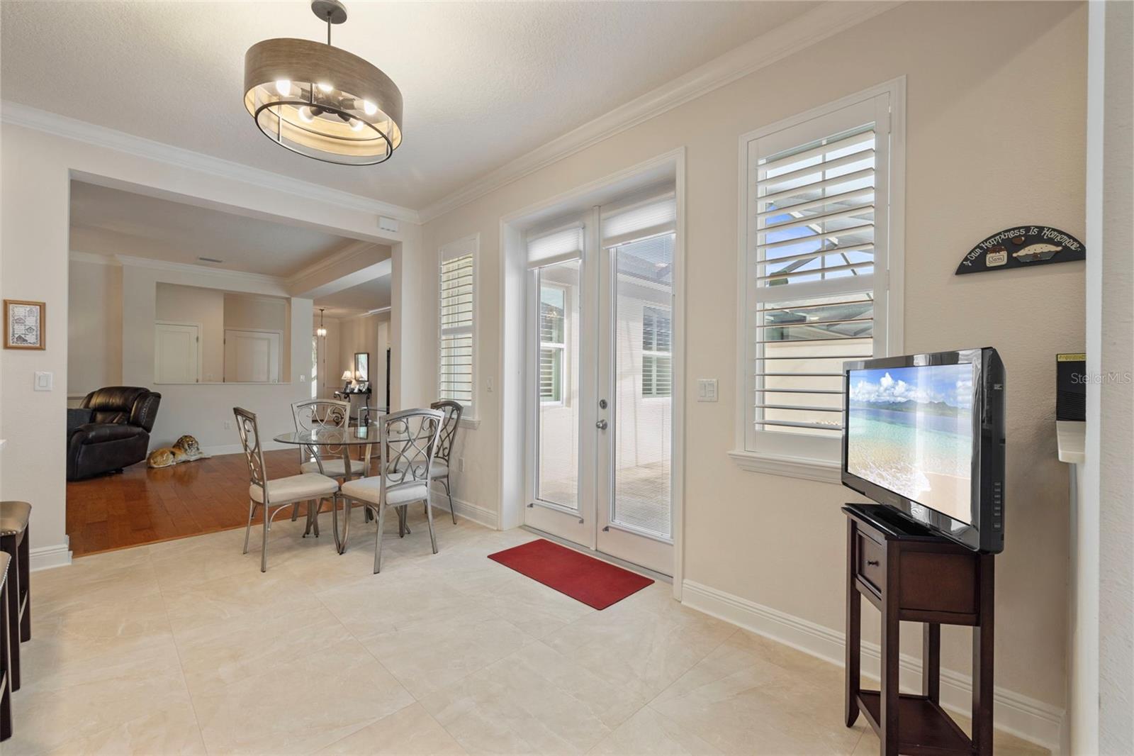 Eat-in kitchen area with doors to the private courtyard-View 1.