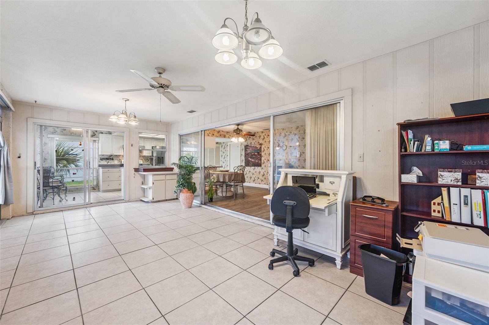 View of the Florida room looking toward the dining room and kitchen