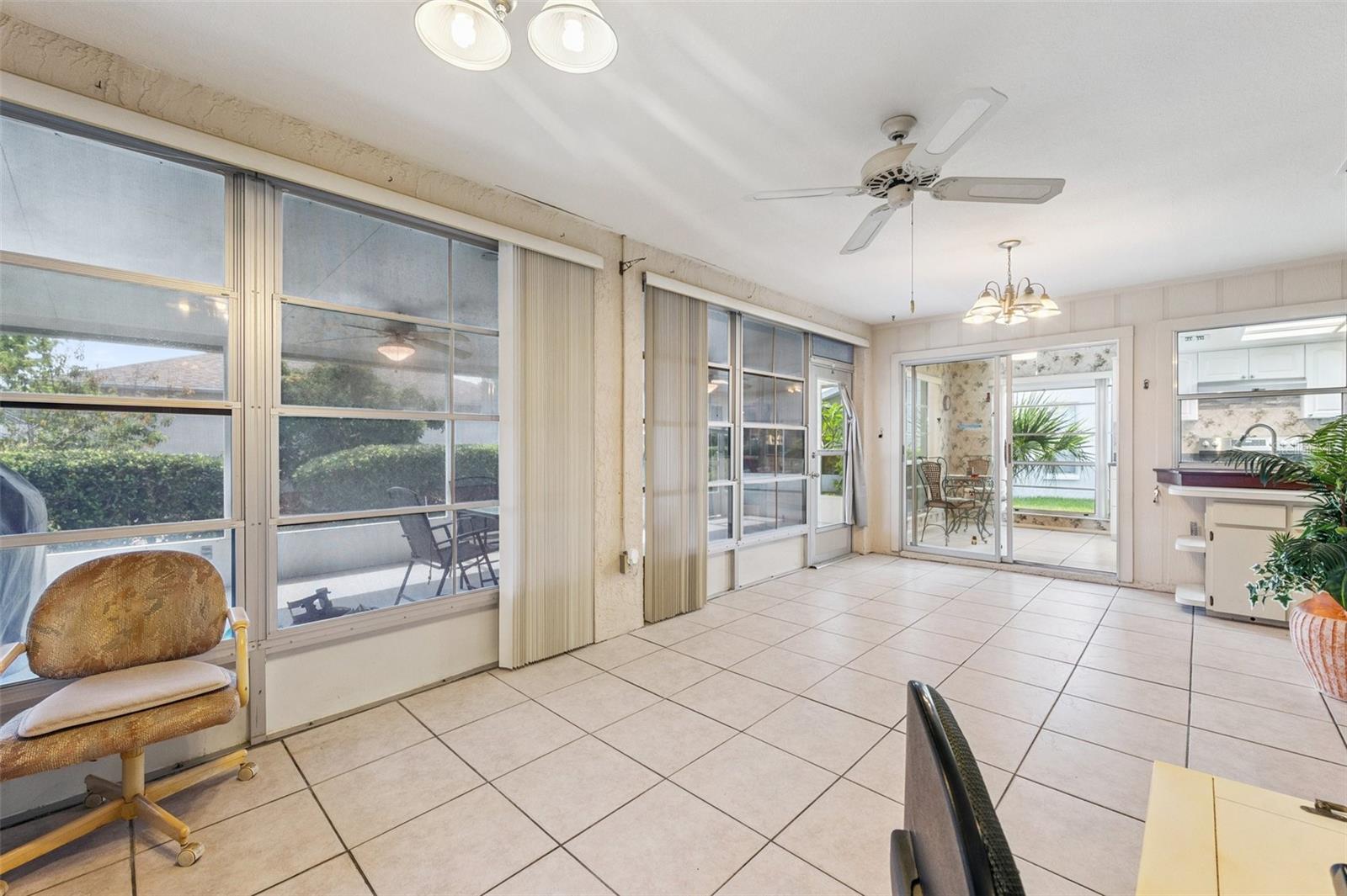 This view shows the access to the oversized screened in lanai (with access to the backyard)