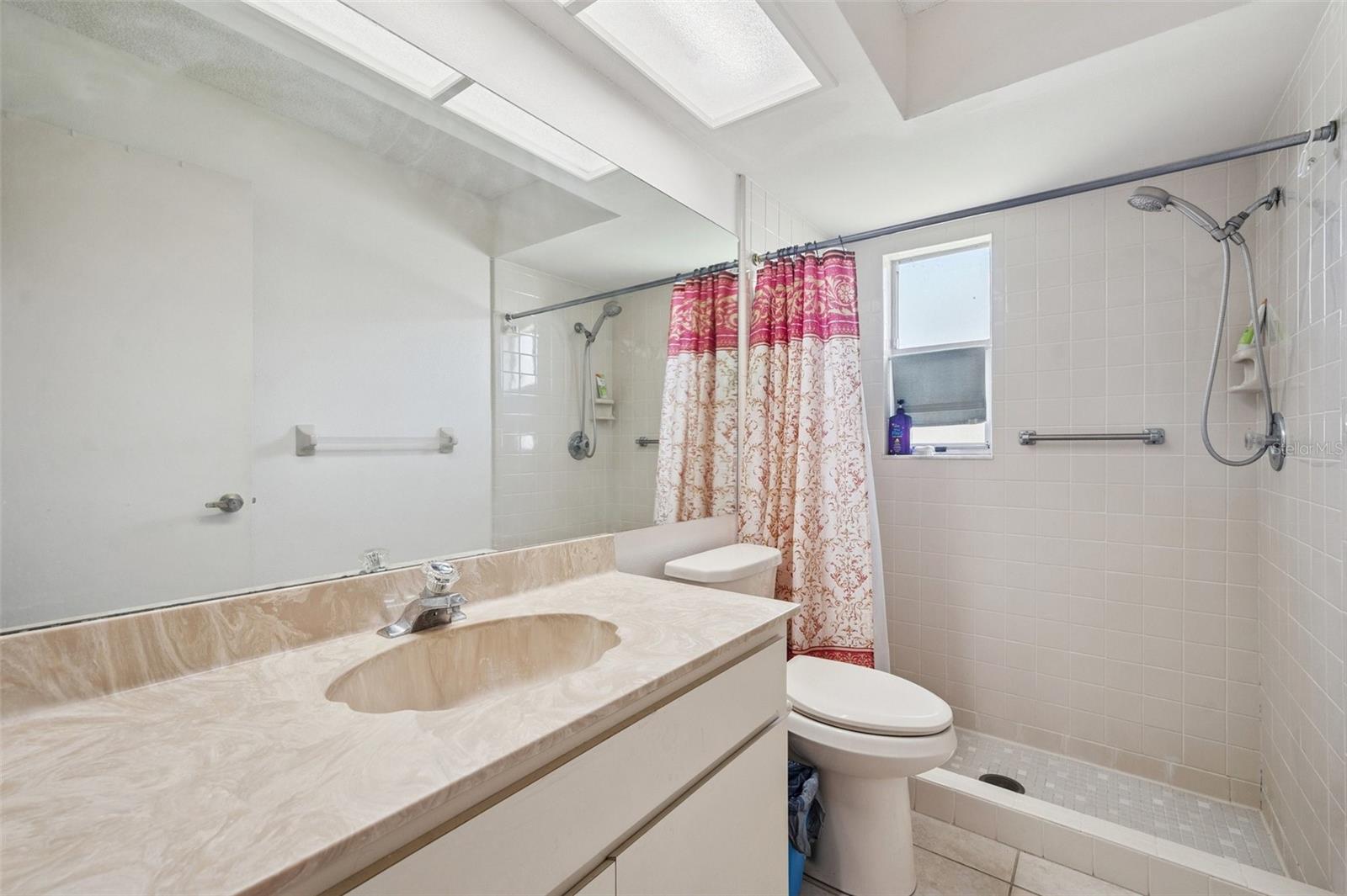 Primary ensuite with step in shower