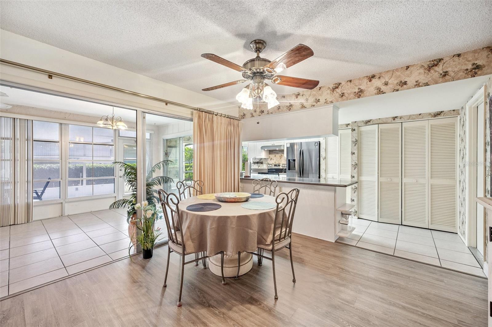 Large dining room with a view of the sliding doors into the Florida room