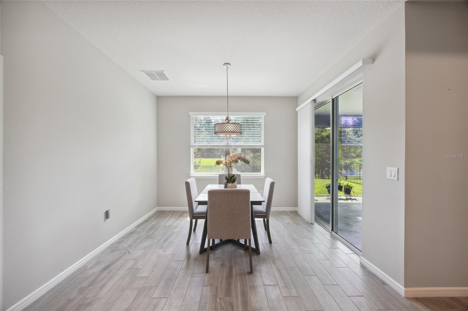 Dining Room overlooks beautiful manicured backyard
