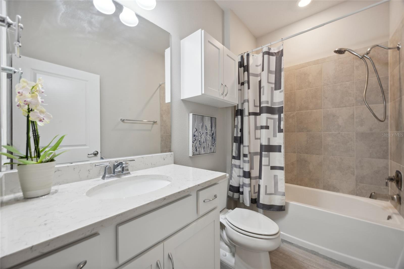 Bath with upgraded tile, shower and tub