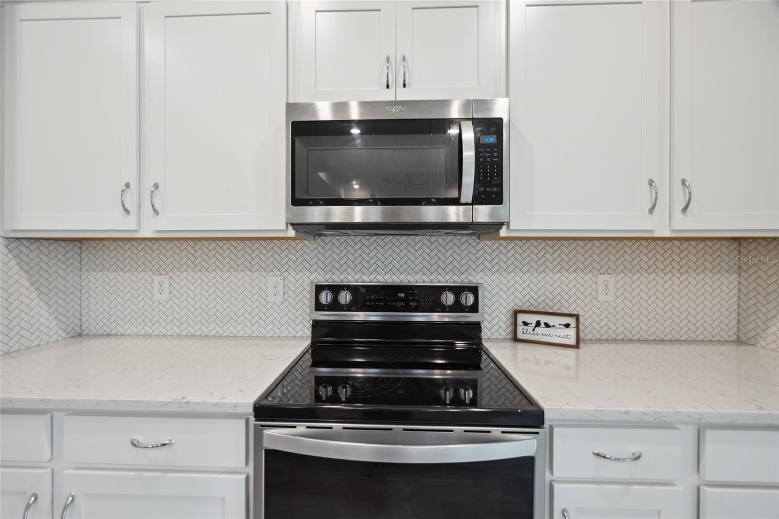 Kitchen , quartz counter tops, stainless appliances.